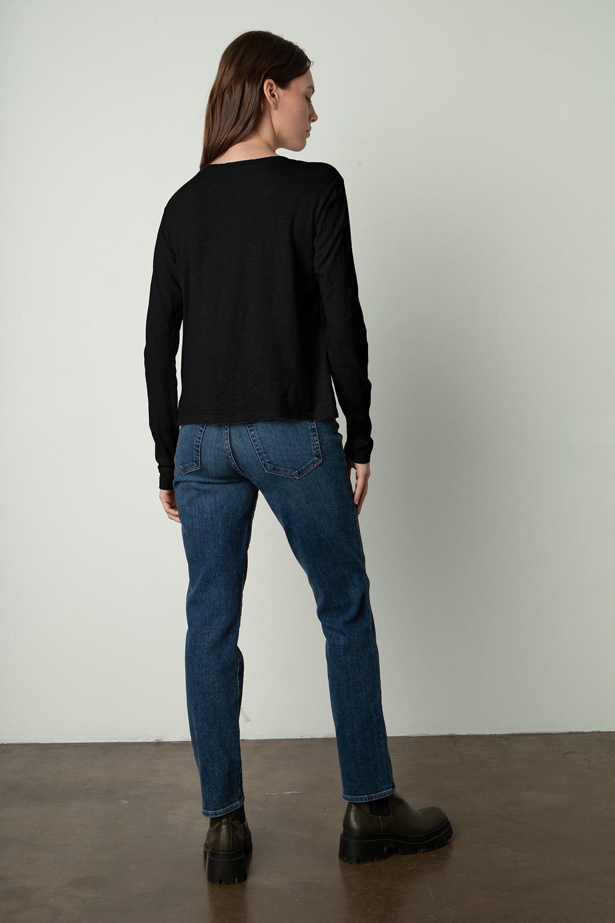  the back view of a woman wearing jeans and a Velvet by Graham & Spencer HESTER CREW NECK TEE. 