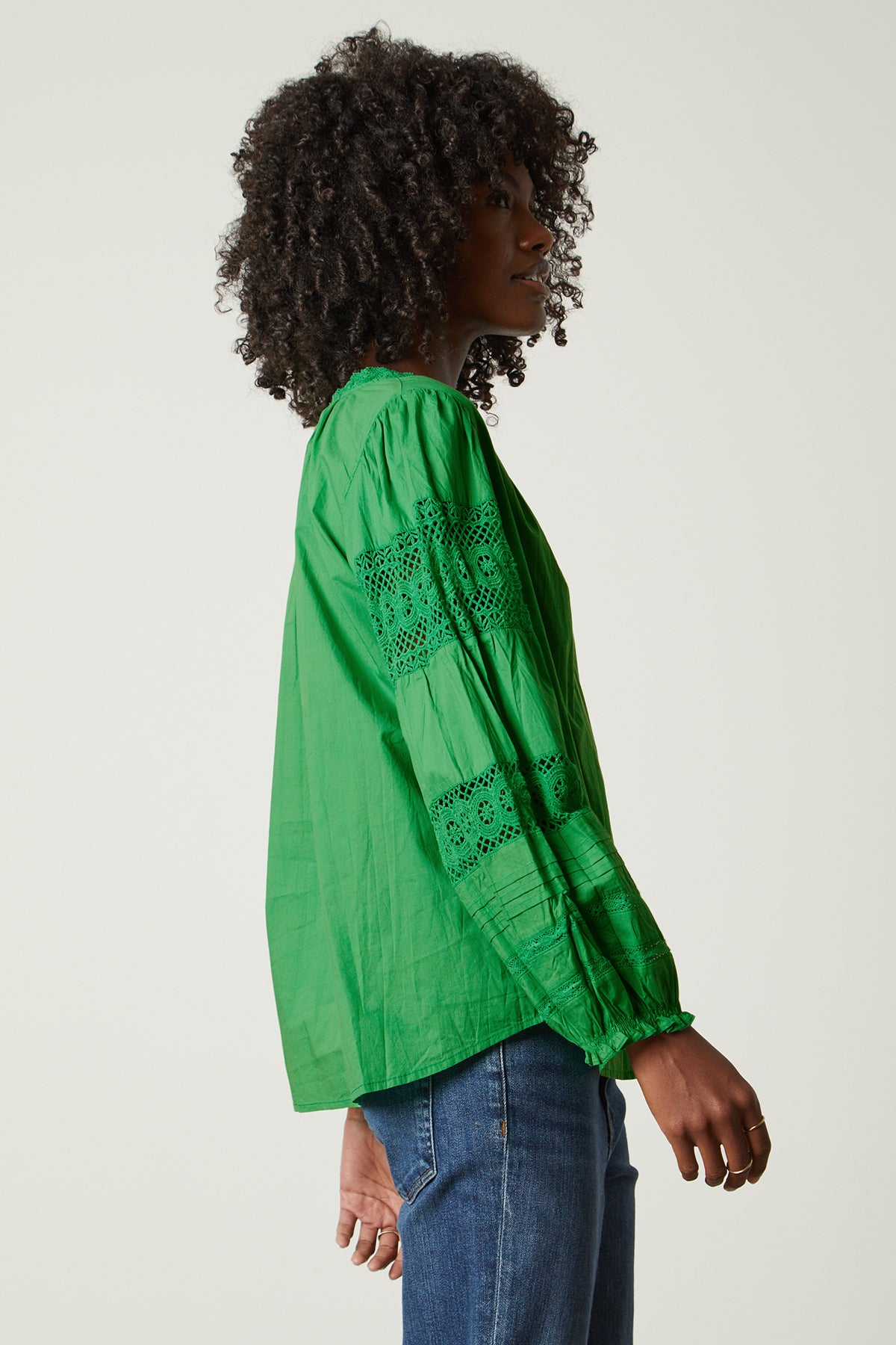 The back view of a woman wearing a Velvet by Graham & Spencer TAYLER COTTON LACE BOHO TOP.-25954312585409