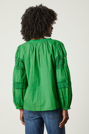 the back view of a woman wearing a Velvet by Graham & Spencer TAYLER COTTON LACE BOHO TOP
