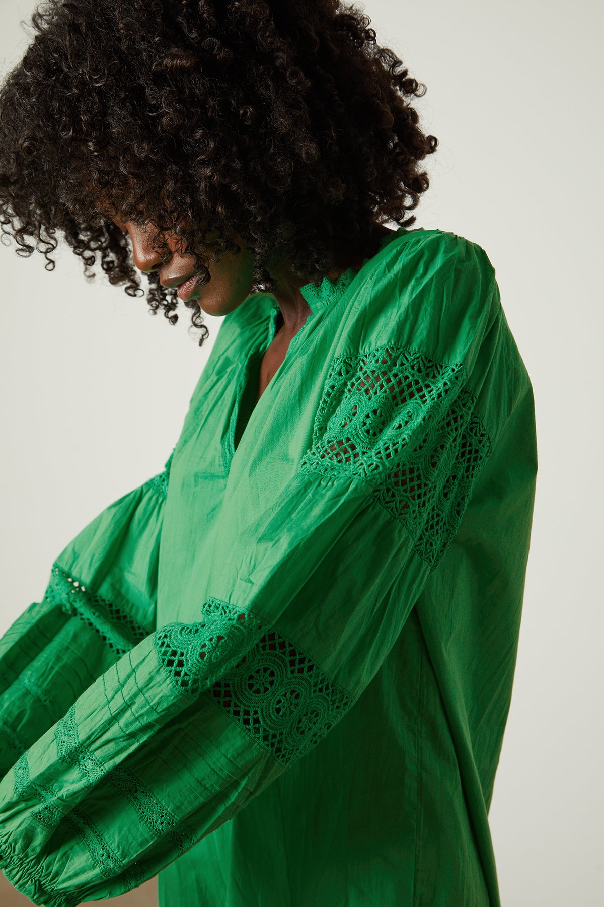 a woman wearing a TAYLER COTTON LACE BOHO TOP blouse by Velvet by Graham & Spencer.-25954312650945