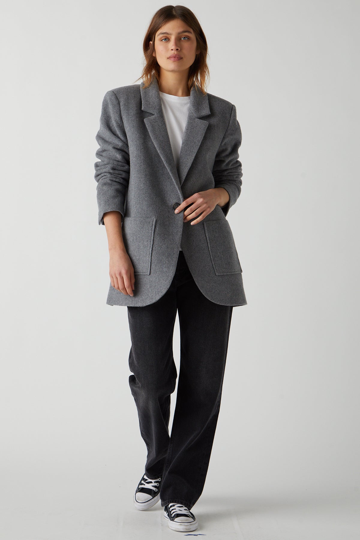   The model is wearing an ALAMOS blazer and black jeans. (brand: Velvet by Jenny Graham) 