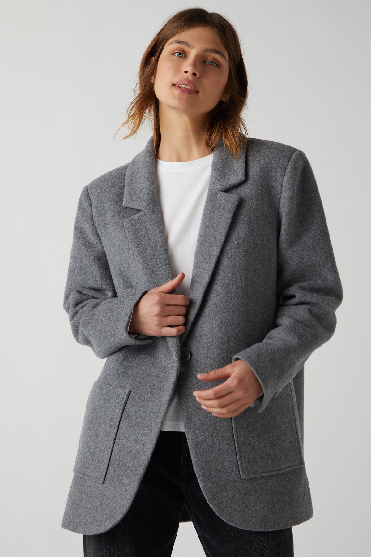   The model is wearing a grey wool ALAMOS BLAZER by Velvet by Jenny Graham. 