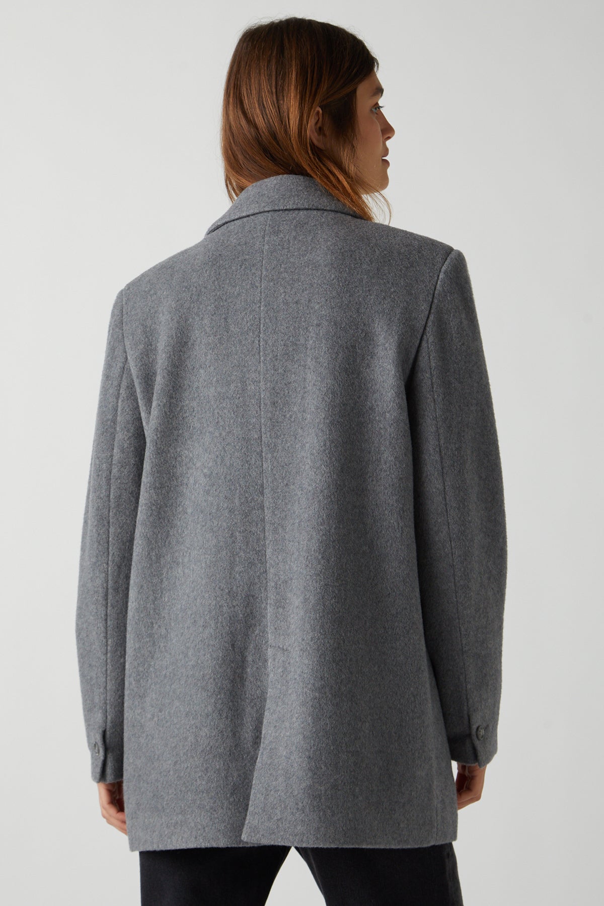   The back view of a woman wearing the Velvet by Jenny Graham ALAMOS BLAZER. 