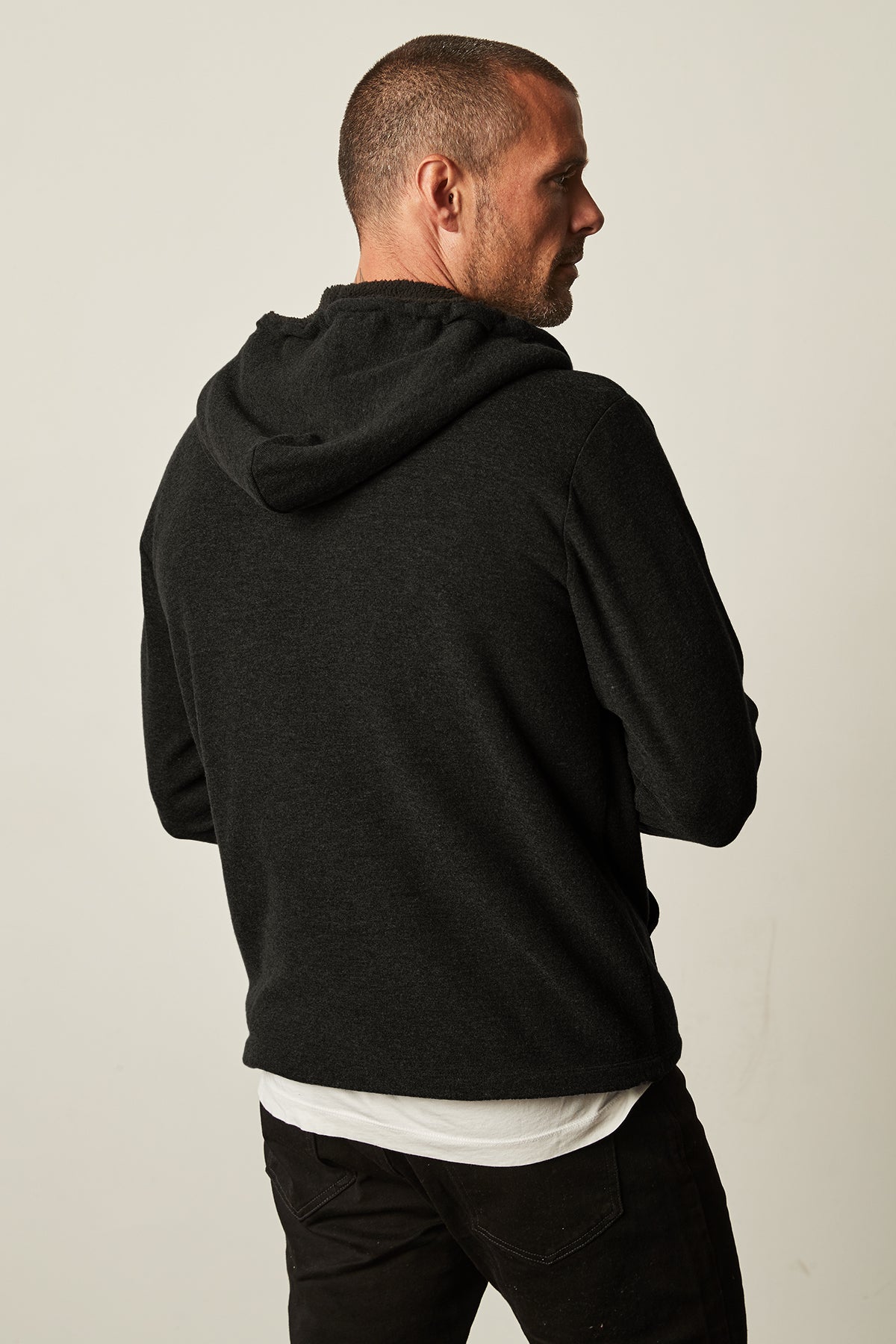 The back of a man wearing a Velvet by Graham & Spencer SALVADORE SHERPA LINED HOODIE with an adjustable drawstring hood.-25484071469249