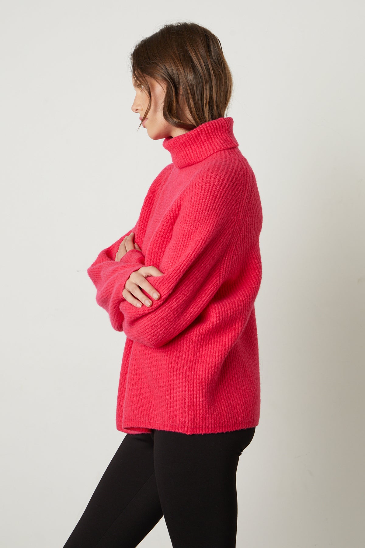 A woman wearing a Velvet by Graham & Spencer JUDITH TURTLENECK SWEATER.-25548630589633