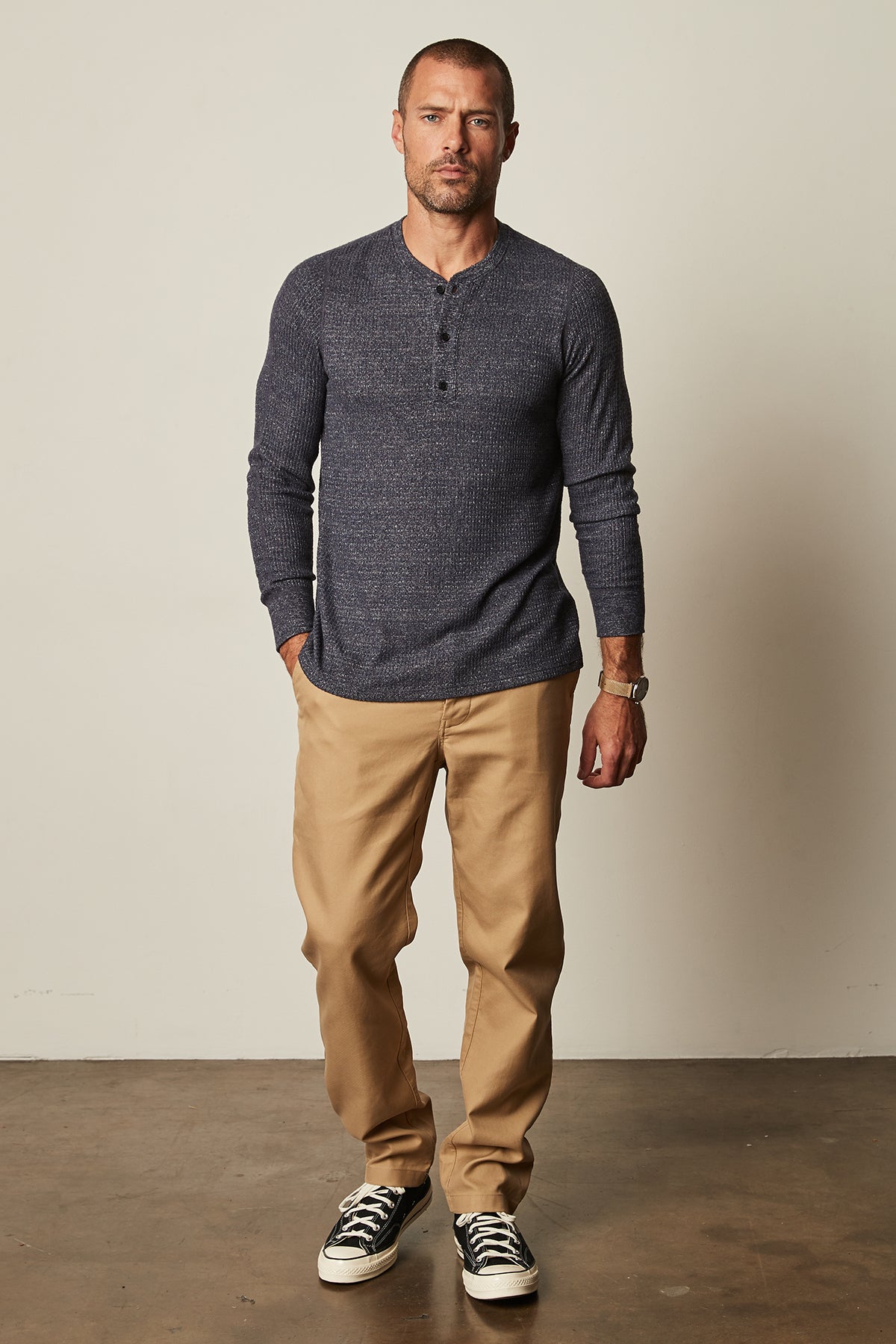   Model standing wearing Anthony Thermal Henley in navy blue with Aiden pant in khaki full length front view 