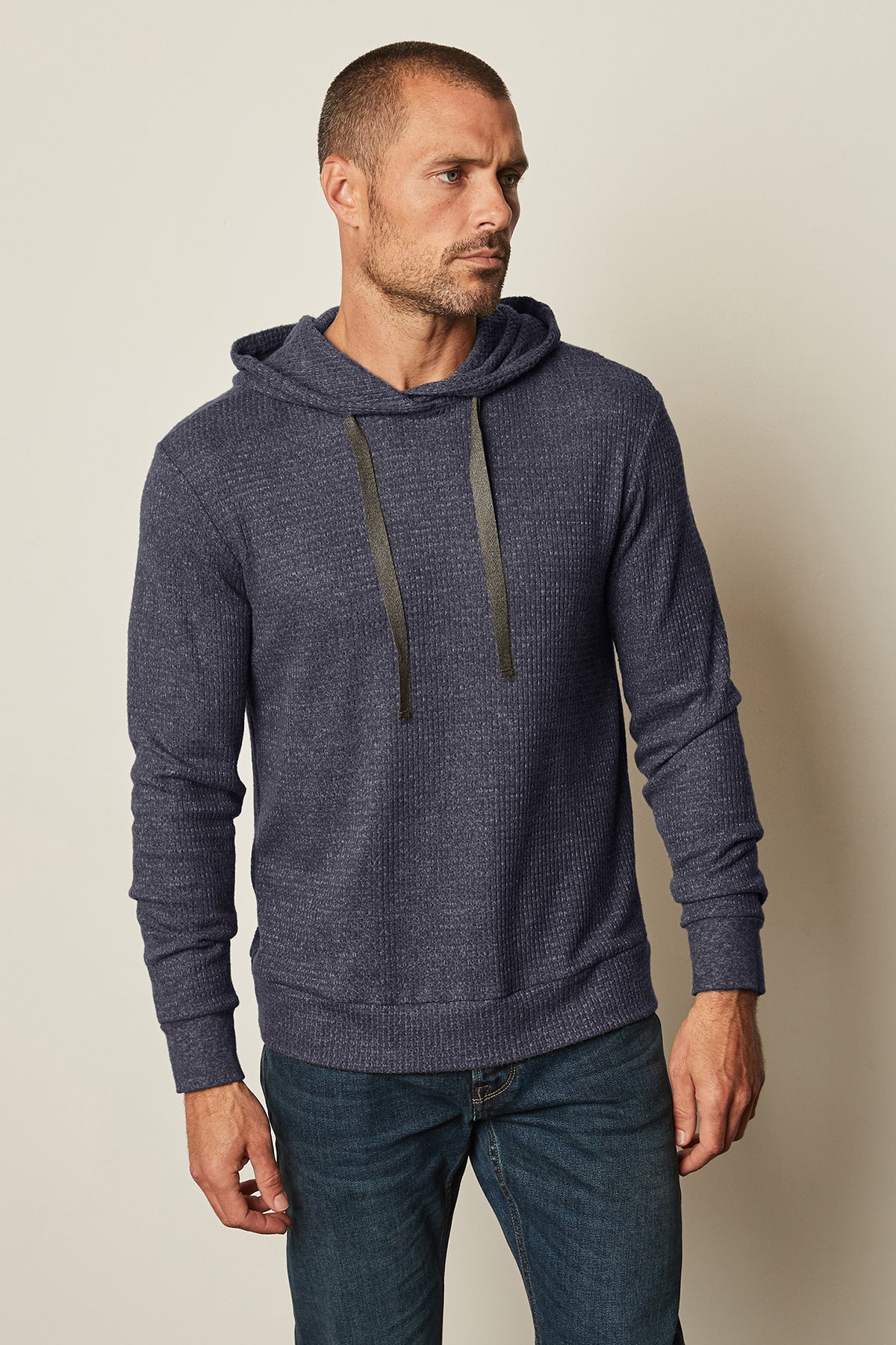 A man wearing a Velvet by Graham & Spencer Colin Thermal Hoodie and jeans.-25483883184321