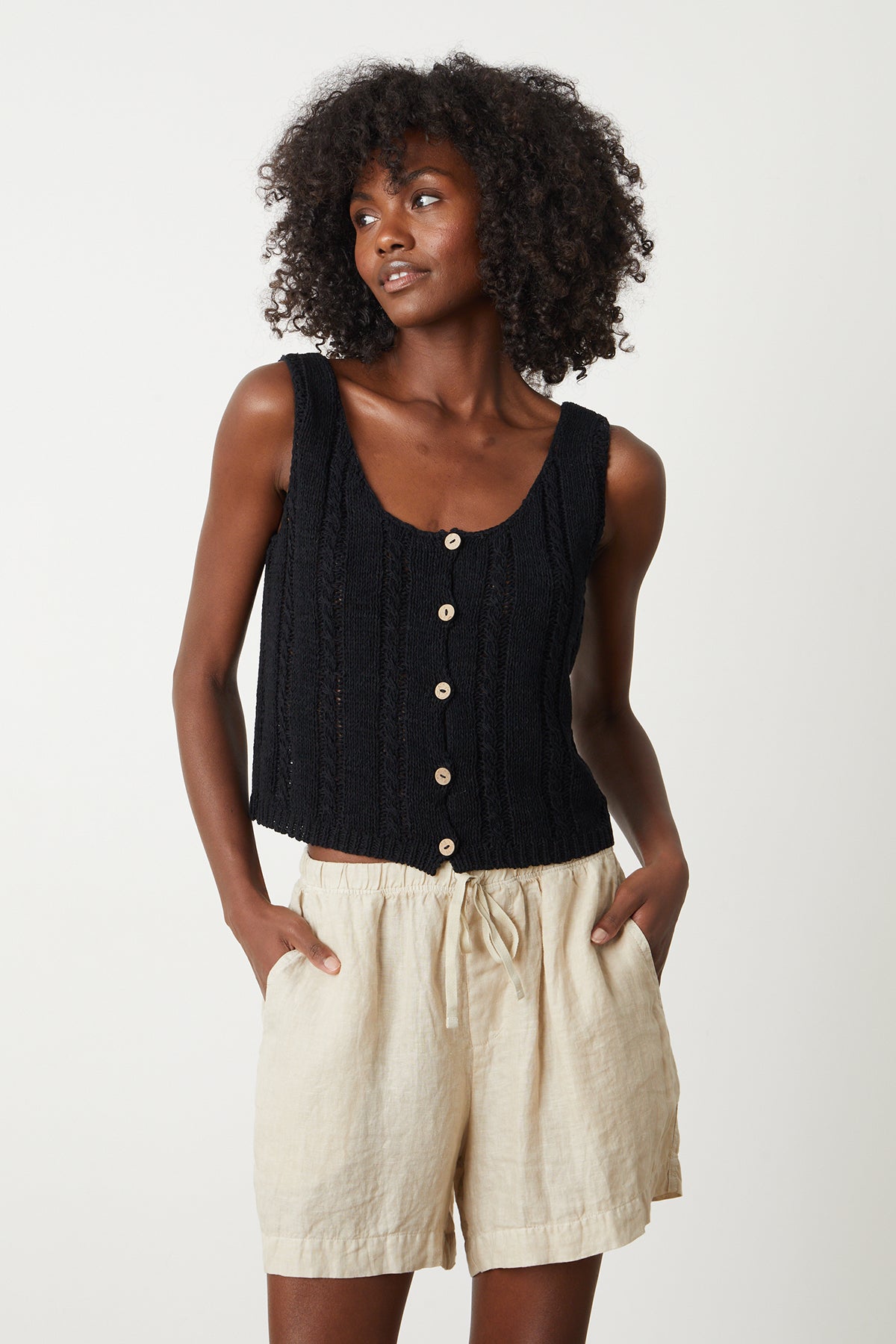   Layla Crochet Stitch Tank Top in black with Tammy short in sand front, model hands in pockets 