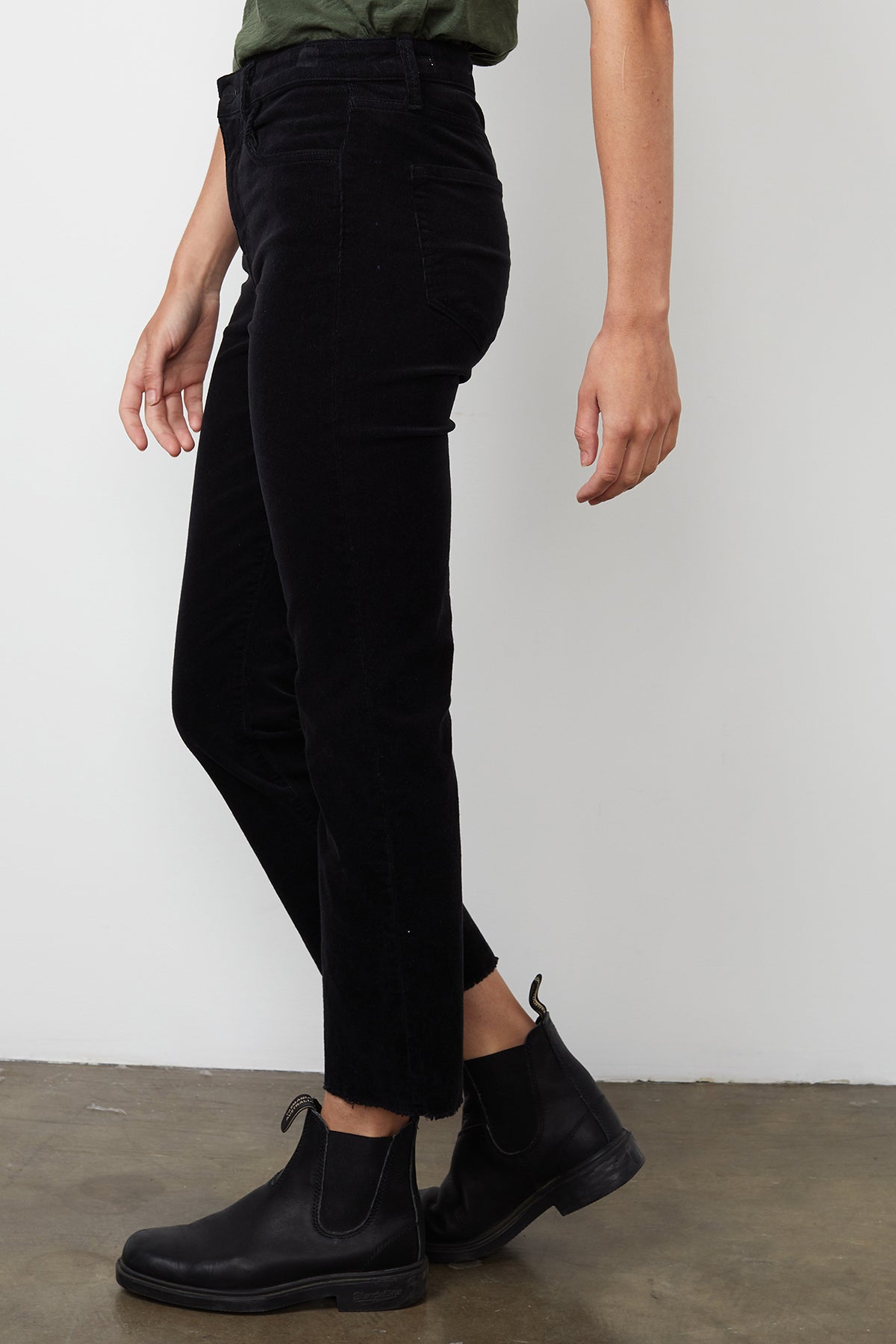 A woman wearing Velvet by Graham & Spencer's CANDACE CORDUROY HIGH RISE CROP JEAN in fall-inspired bottoms.-14889566240961