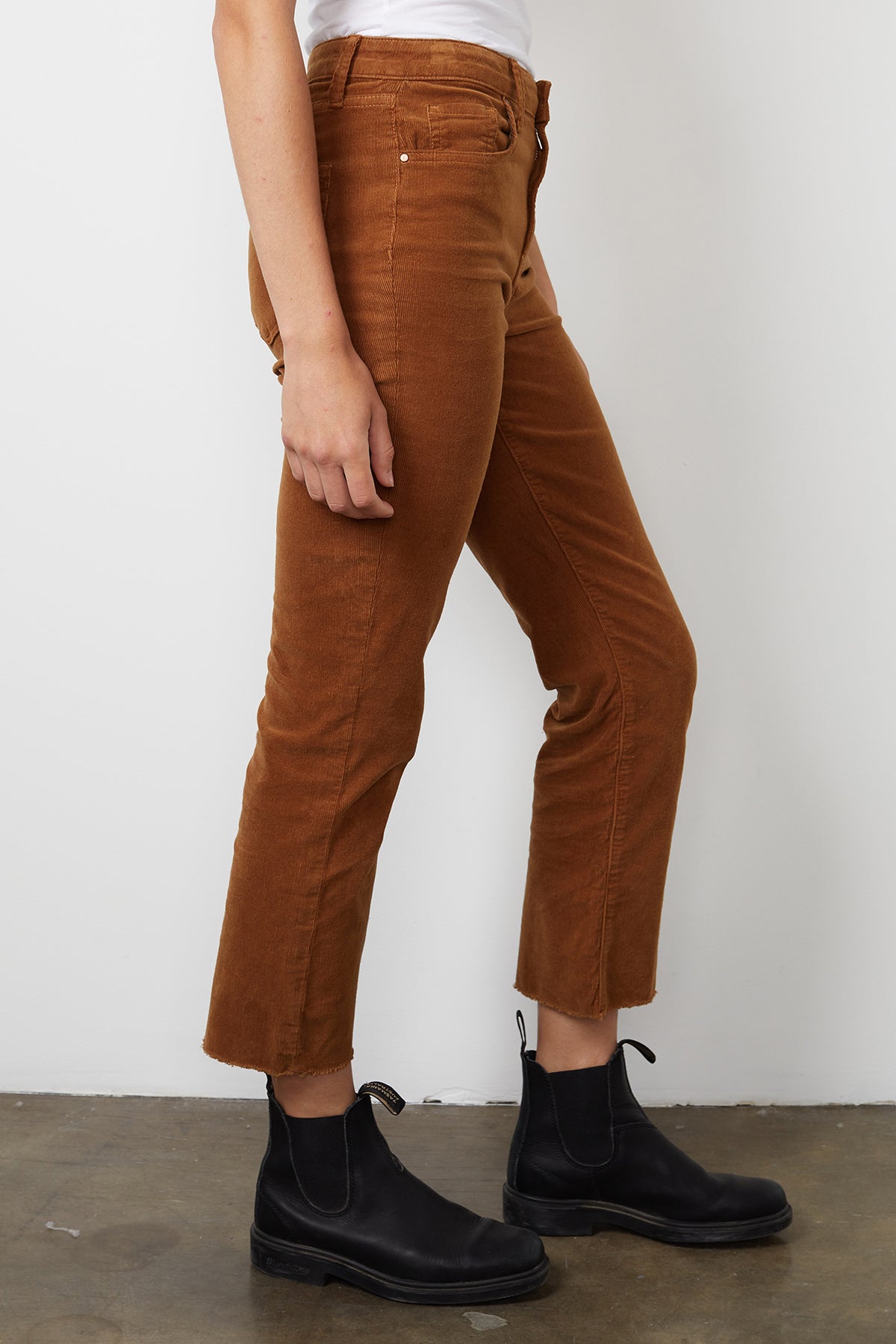 A woman wearing brown Velvet by Graham & Spencer Candace Corduroy High Rise Crop Jeans made from cotton corduroy.-14890707812545