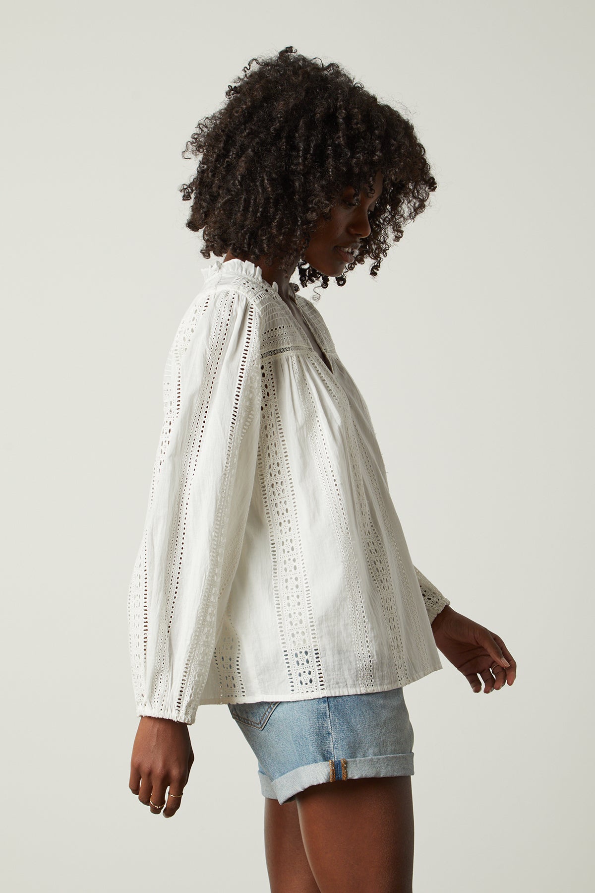   Jordyn Embroidered V-Neck Top in cream with blue denim shorts side 