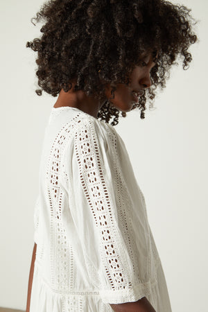 Margaret dress in embroidered cream close up detail of fabric on sleeve and shoulder