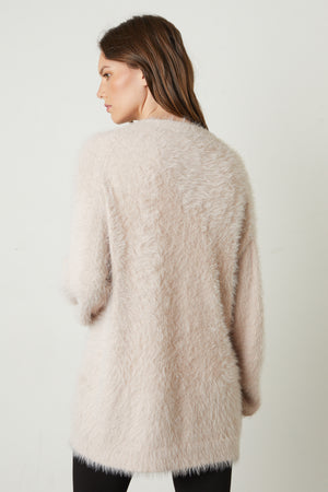 Barb Feather Yarn Button Front Cardigan in pale blush pink back