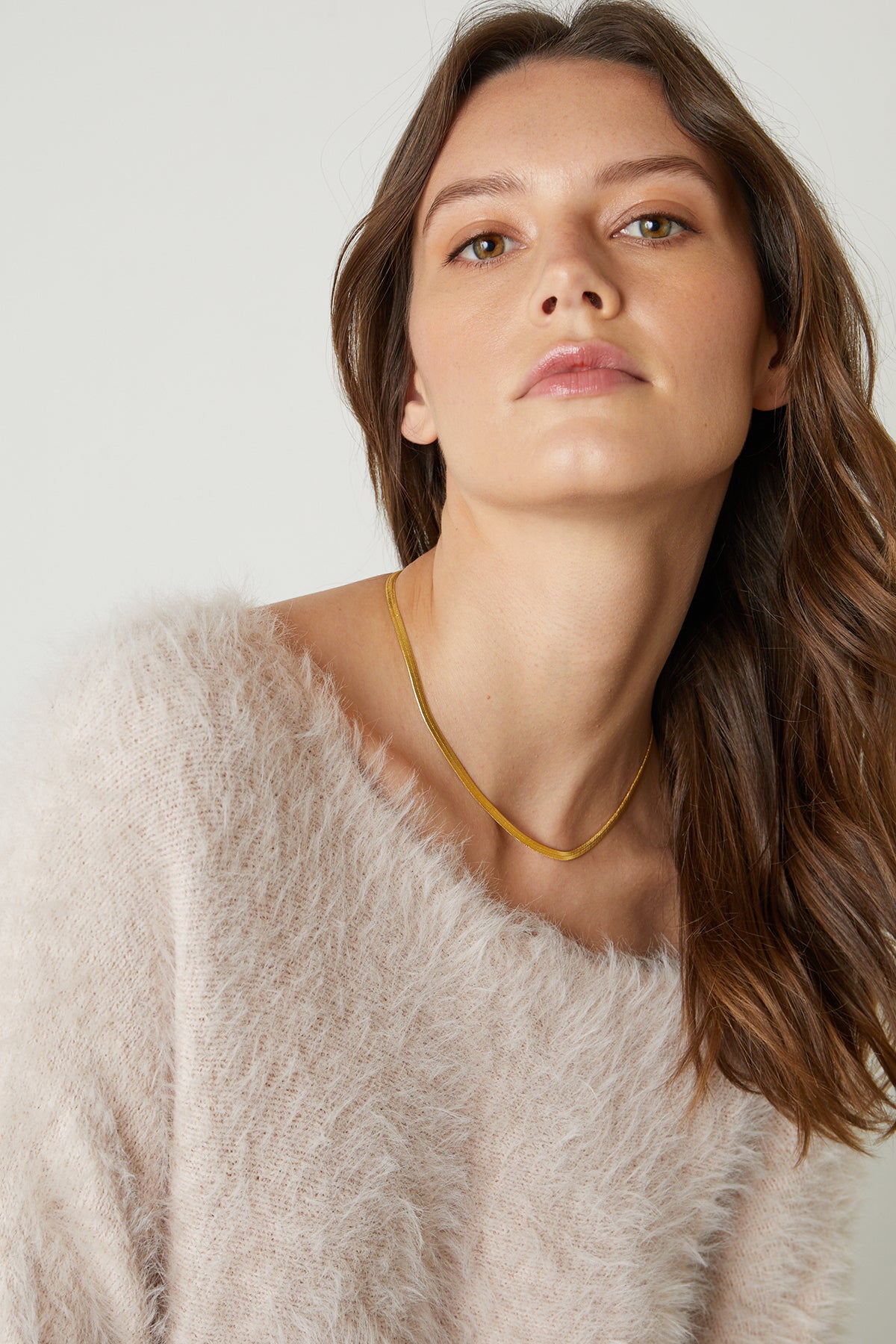   Betty Feather Yarn Boat Neck Sweater in pale blush pink front detail with gold necklace 