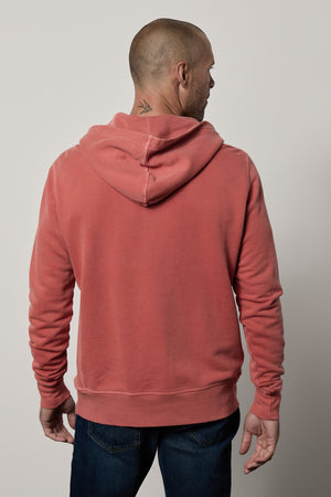The back view of a man wearing a Velvet by Graham & Spencer GRANT FRENCH TERRY HOODIE with pockets.