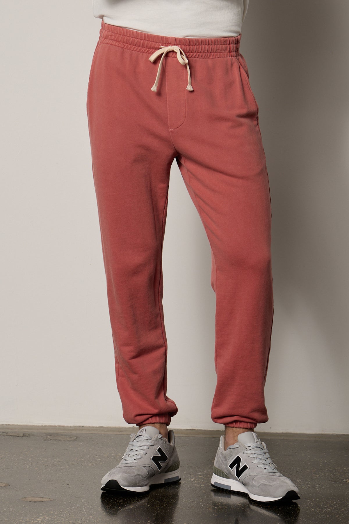 a man wearing Velvet by Graham & Spencer NELSON FRENCH TERRY JOGGER sweatpants and white sneakers.-26207907414209