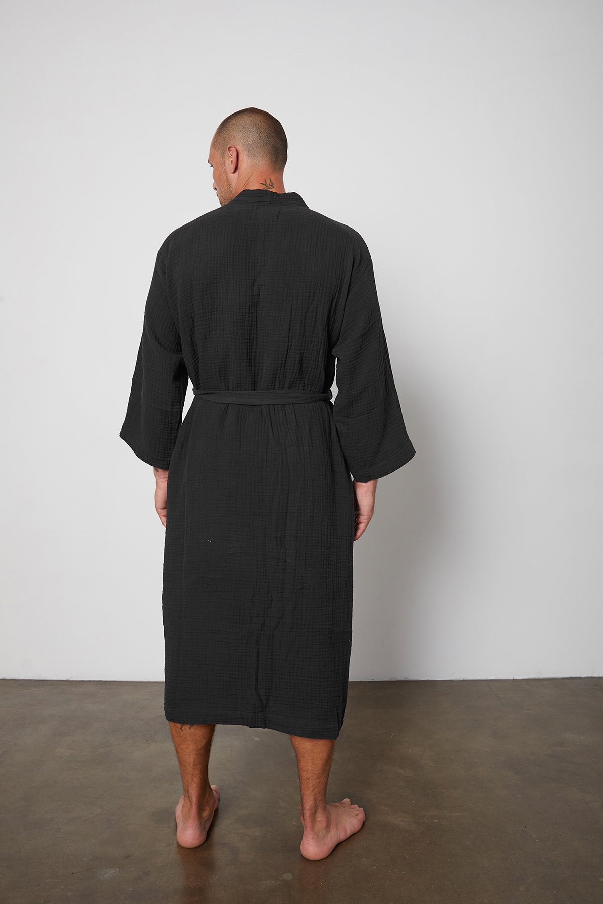 the back view of a man wearing a Jenny Graham Home Cotton Gauze Robe.-23556219797697