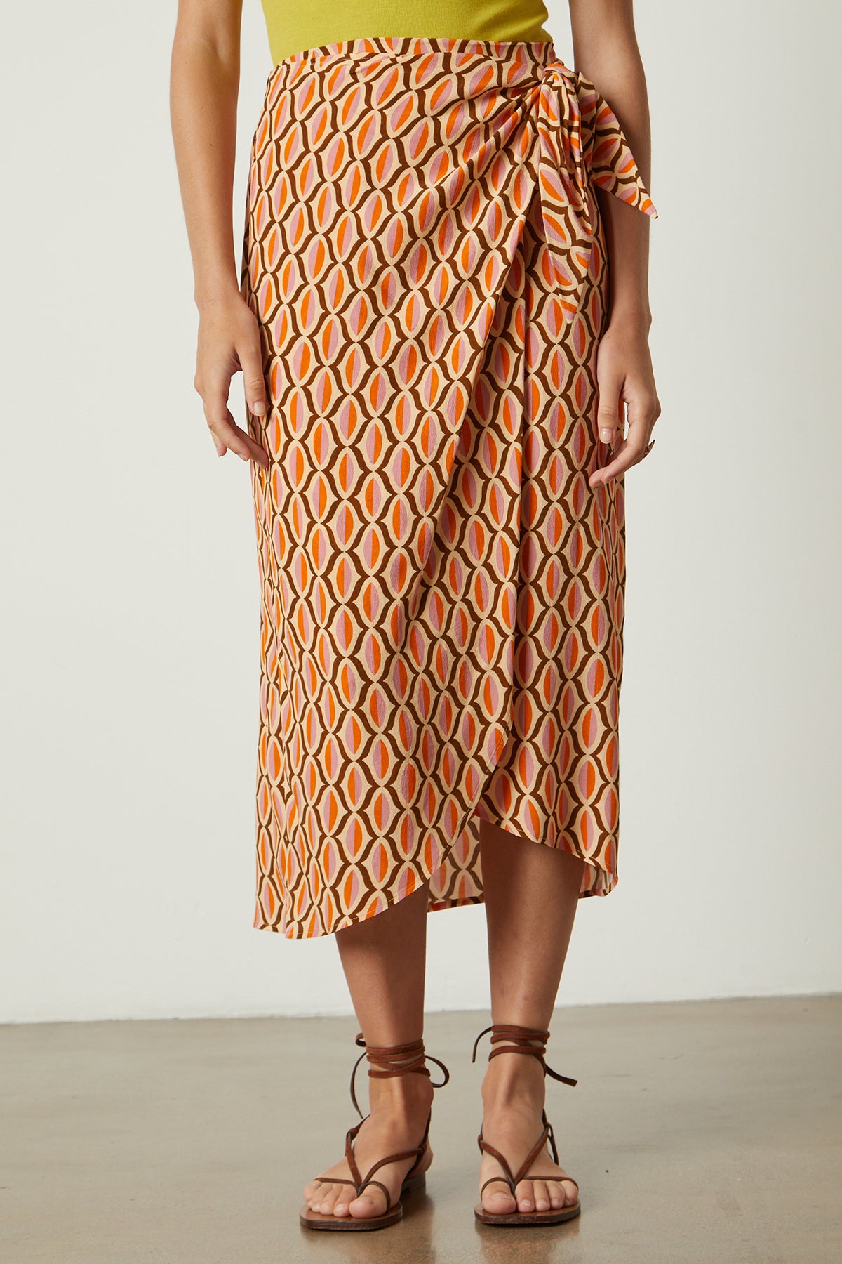 Alisha skirt in orange geometric pattern with sandals front-26078931878081