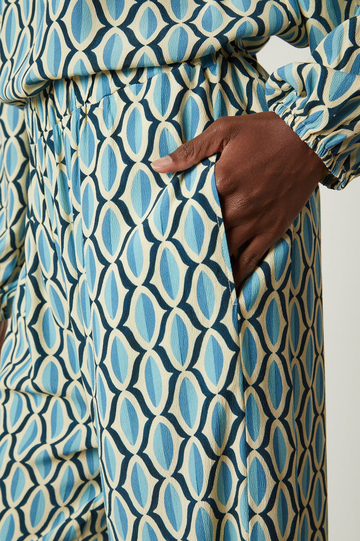   Eliza pant in blue geometric print crepe close up pocket detail 