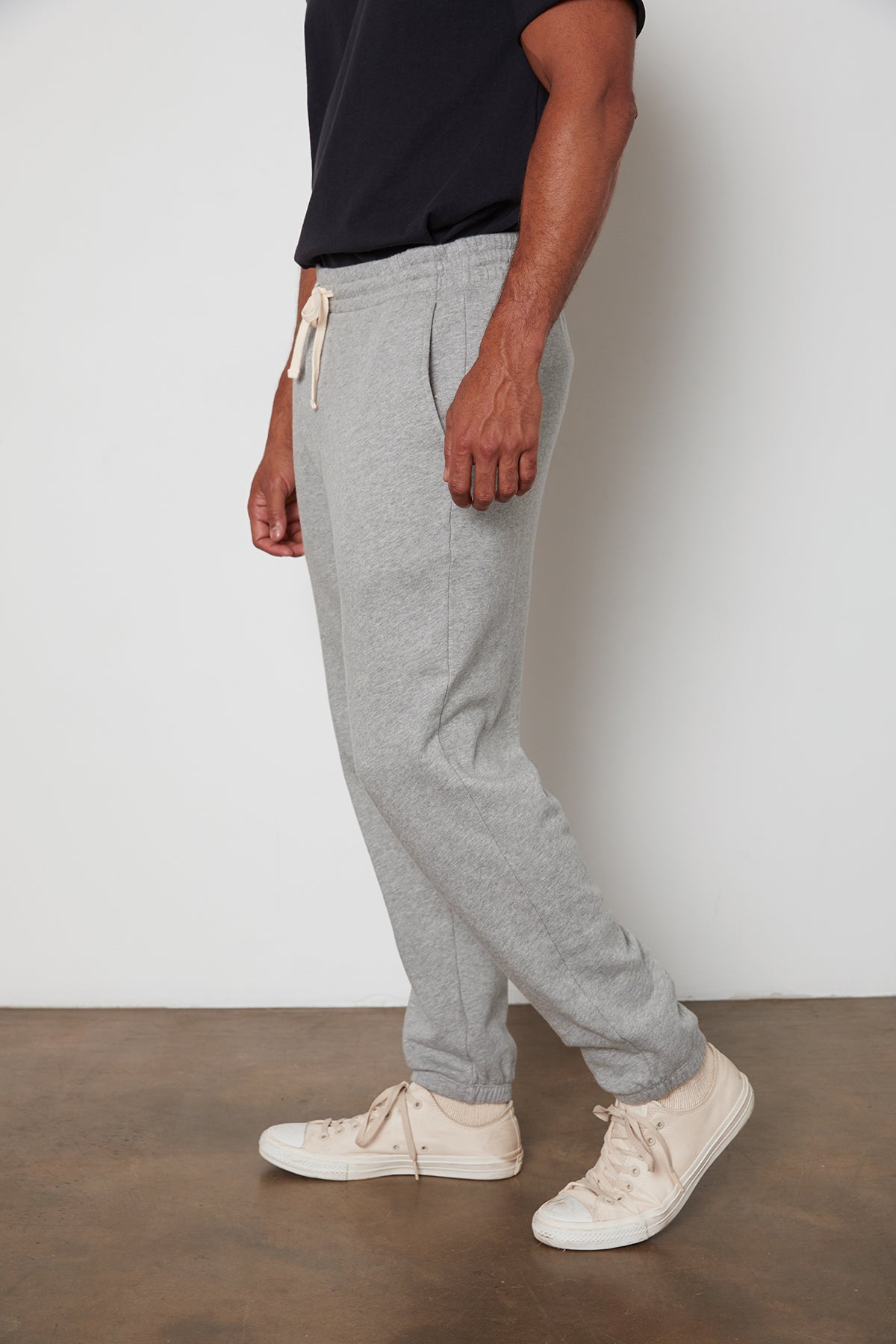 A man wearing Velvet by Graham & Spencer's JUDAS SWEATPANT, a grey elastic waist sweatpants.-24522874126529
