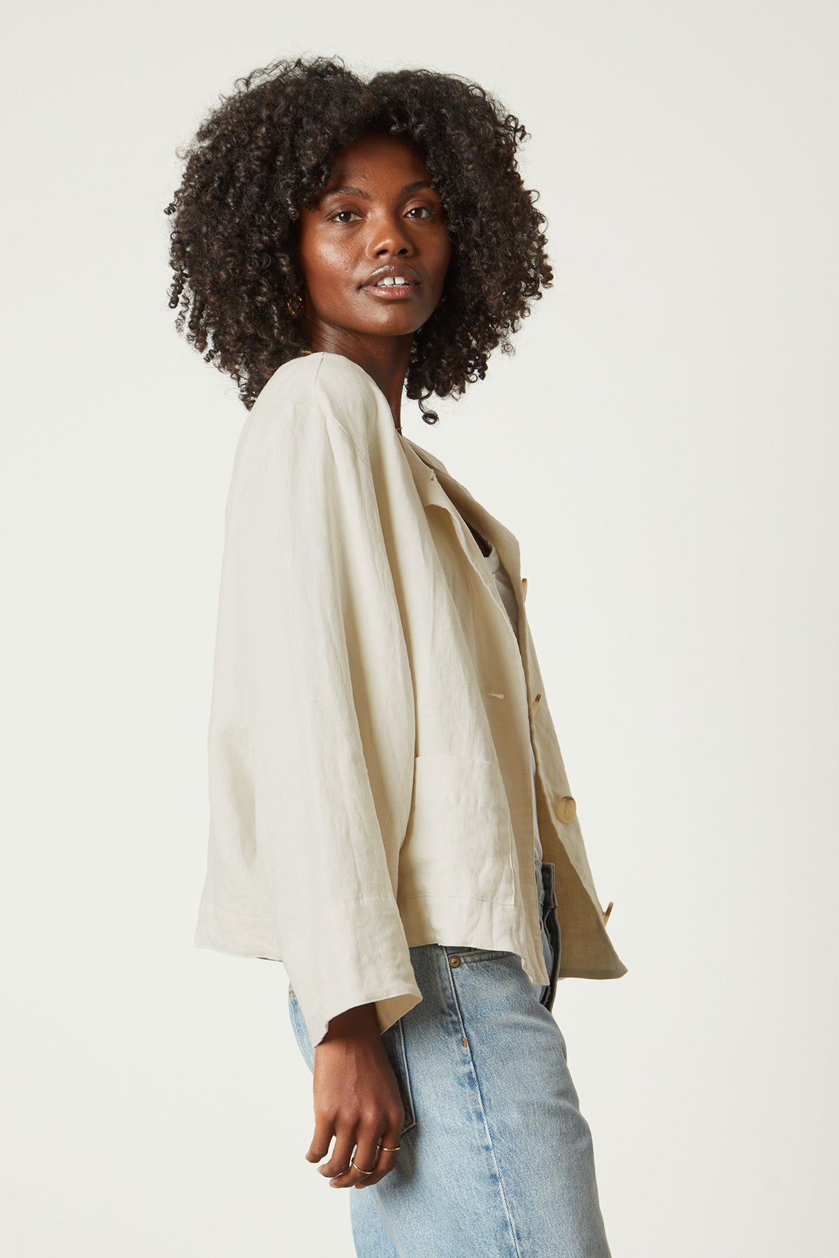   The model is wearing a Velvet by Graham & Spencer BRIELLE HEAVY LINEN JACKET and jeans. 