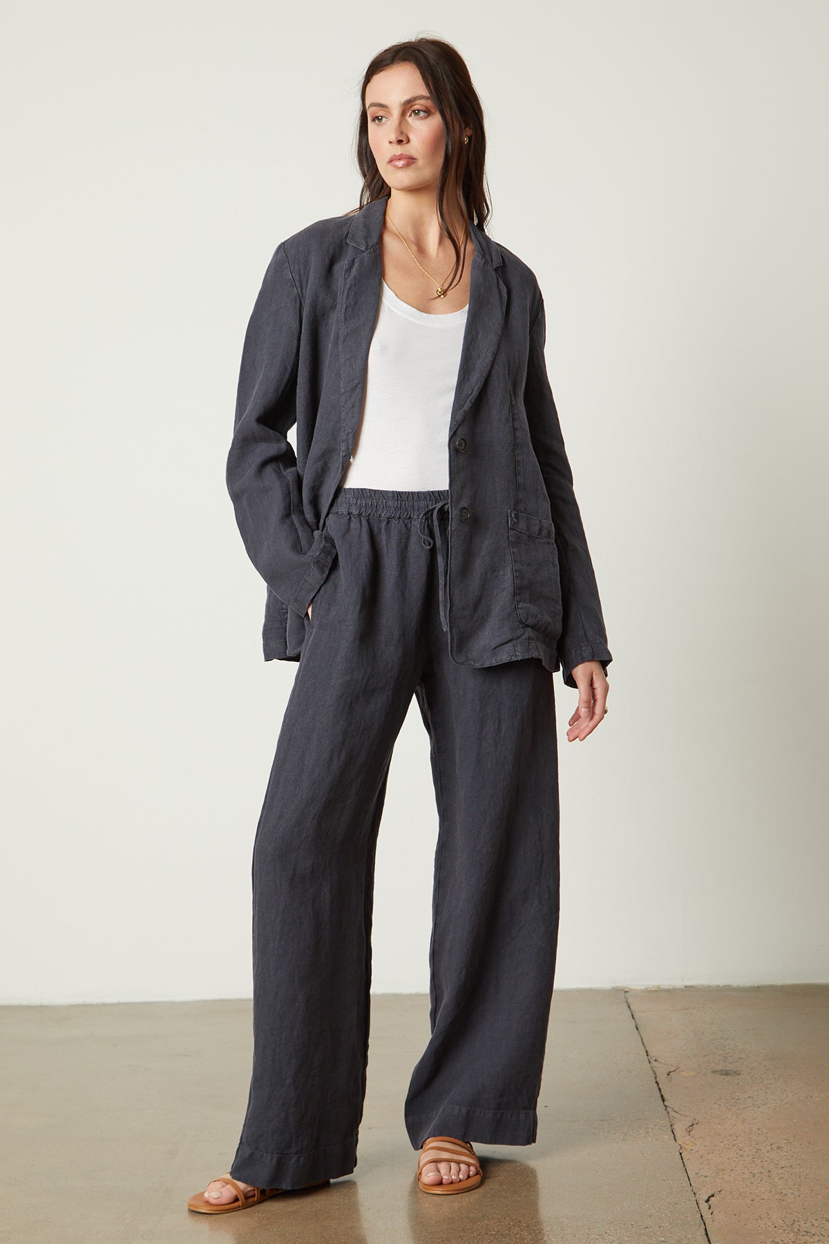   Cassie Blazer in navy copen color with Gwyneth pant and Mossy tank full length front with necklace, earrings, and sandals. 