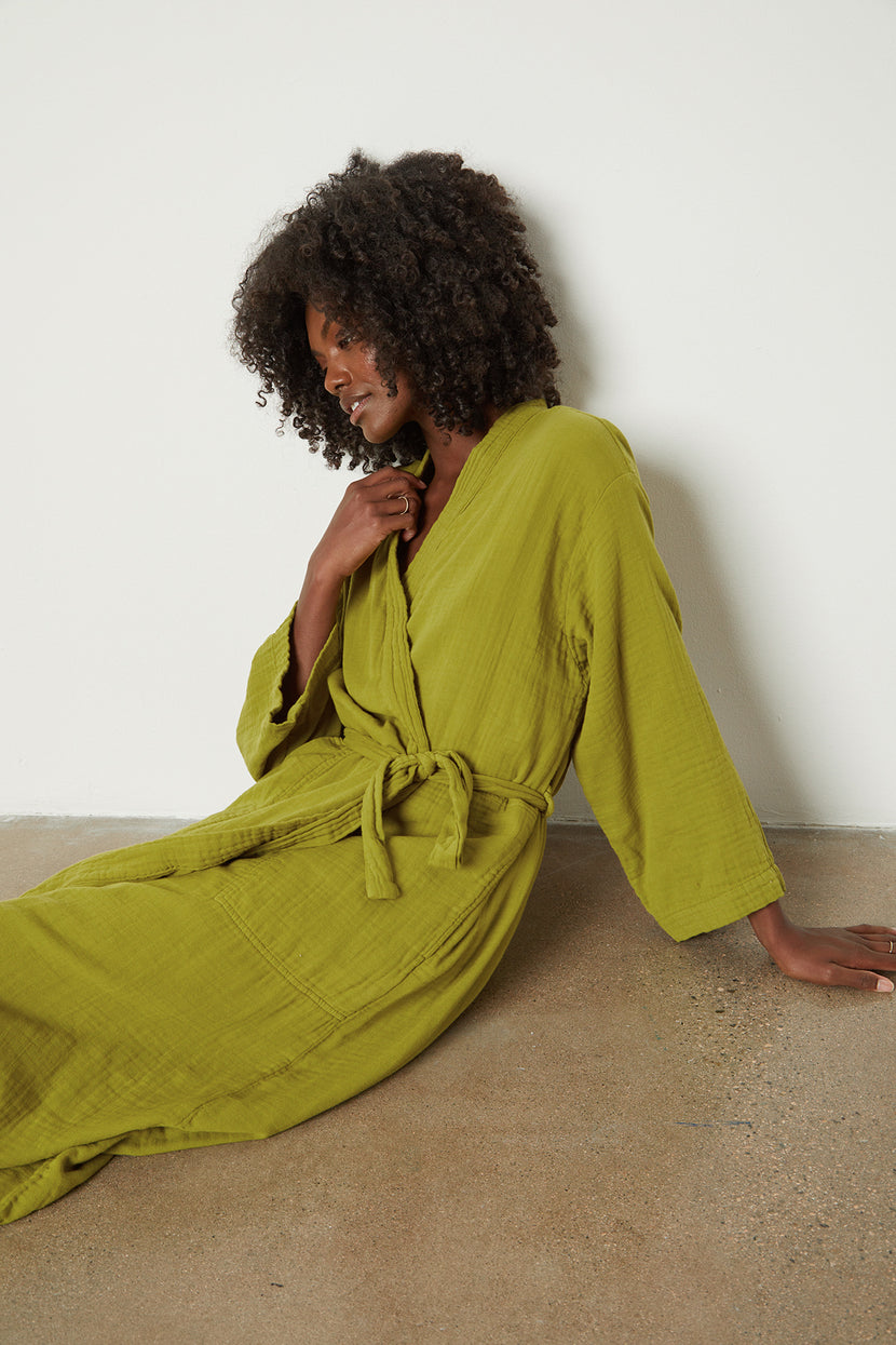 a woman in a COTTON GAUZE ROBE from Jenny Graham Home laying on the floor.