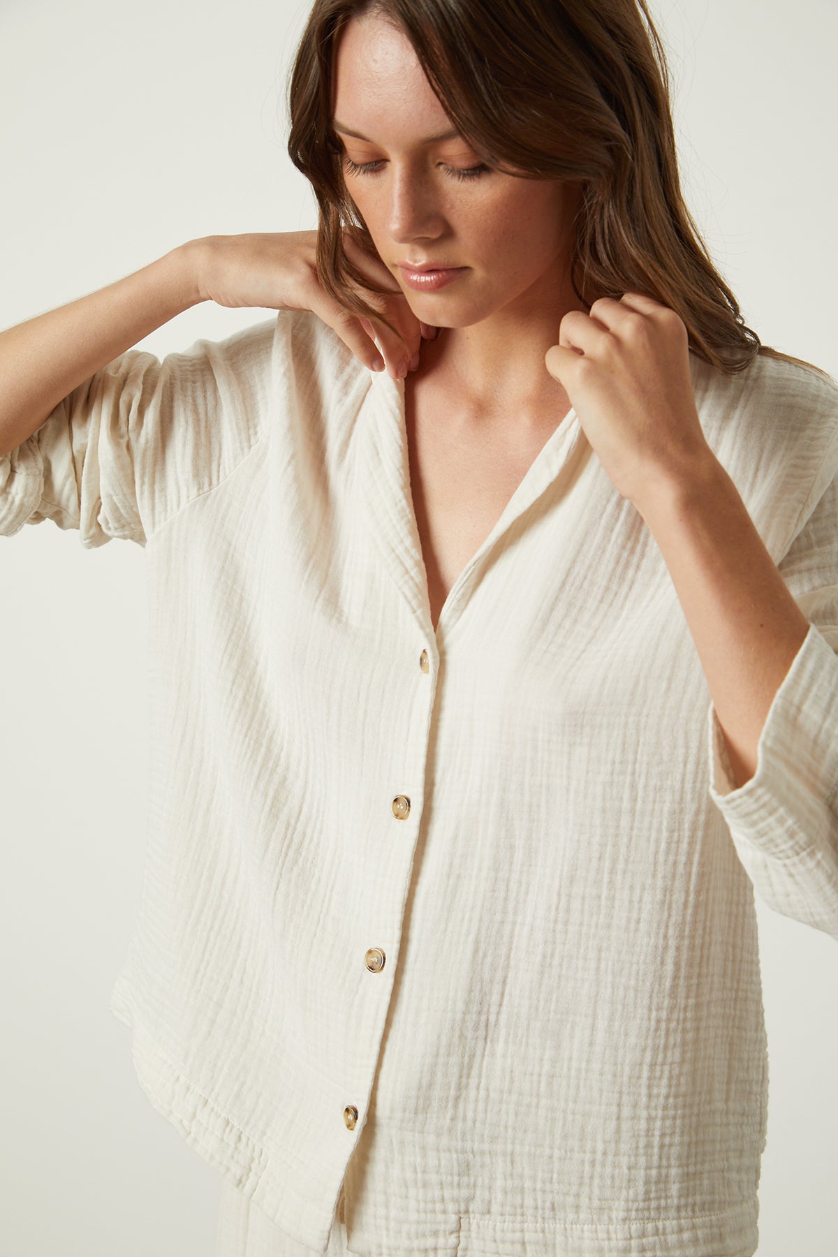   The model is wearing a Jenny Graham Home white button down shirt. 