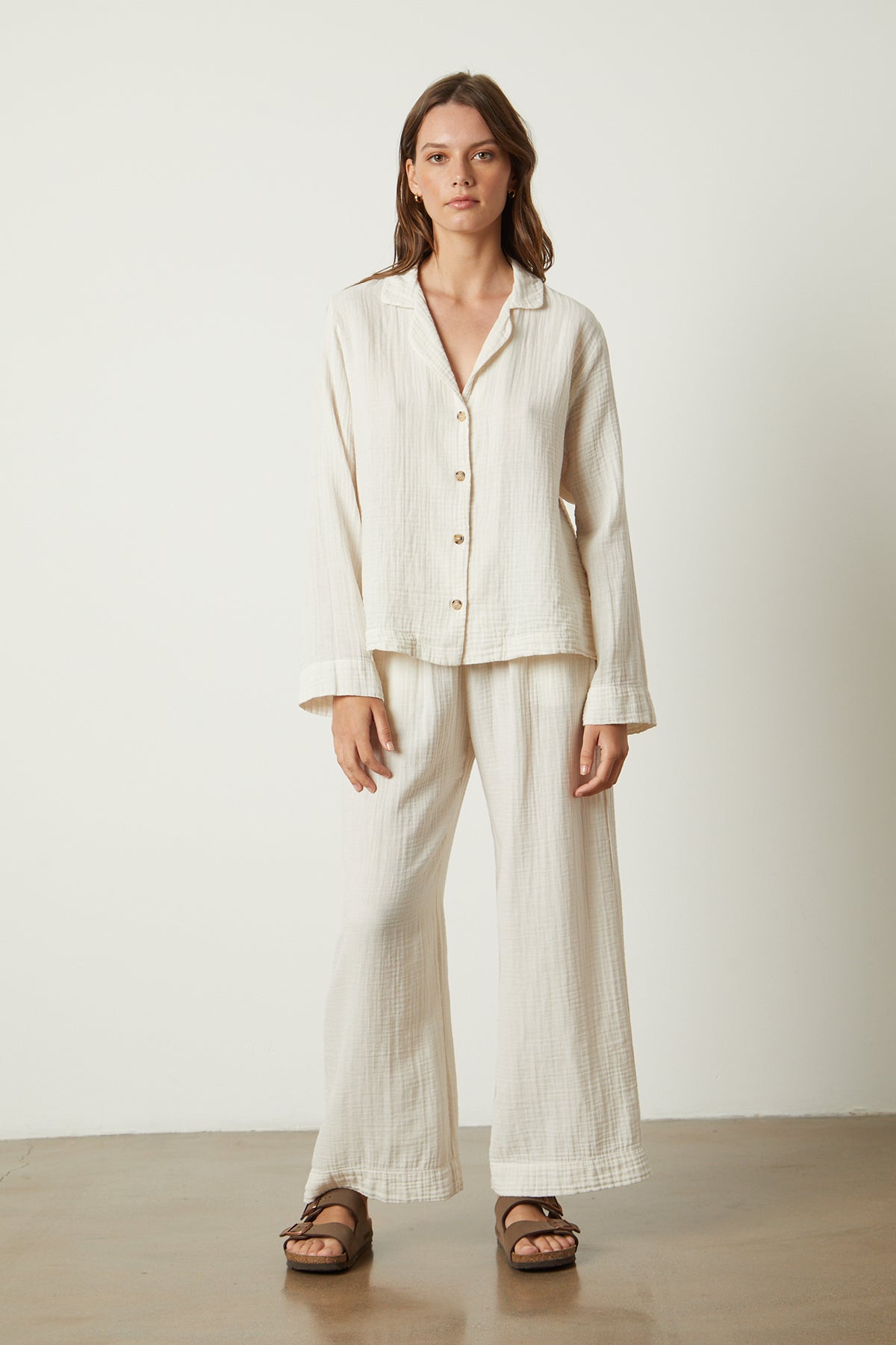 The model is wearing a white linen pajama shirt from Jenny Graham Home.-25519547908289