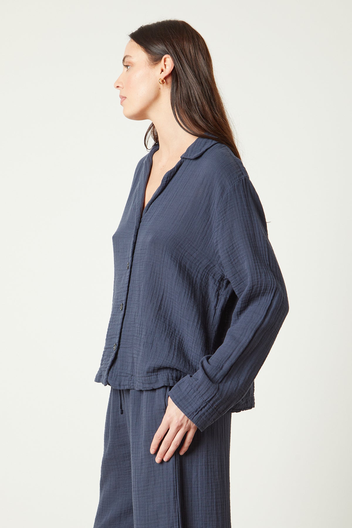   the model is wearing a blue Jenny Graham Home PAJAMA SHIRT and pants. 
