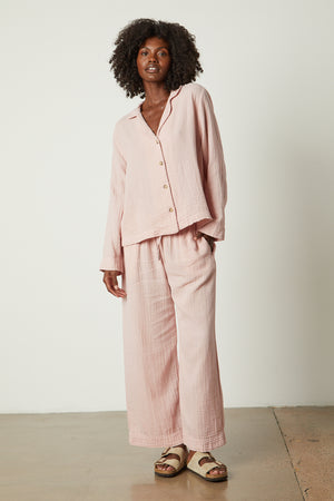 The model is wearing a Jenny Graham Home pink pajama shirt set.