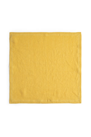 Yellow elegant LINEN NAPKIN isolated on a white background by Jenny Graham Home.