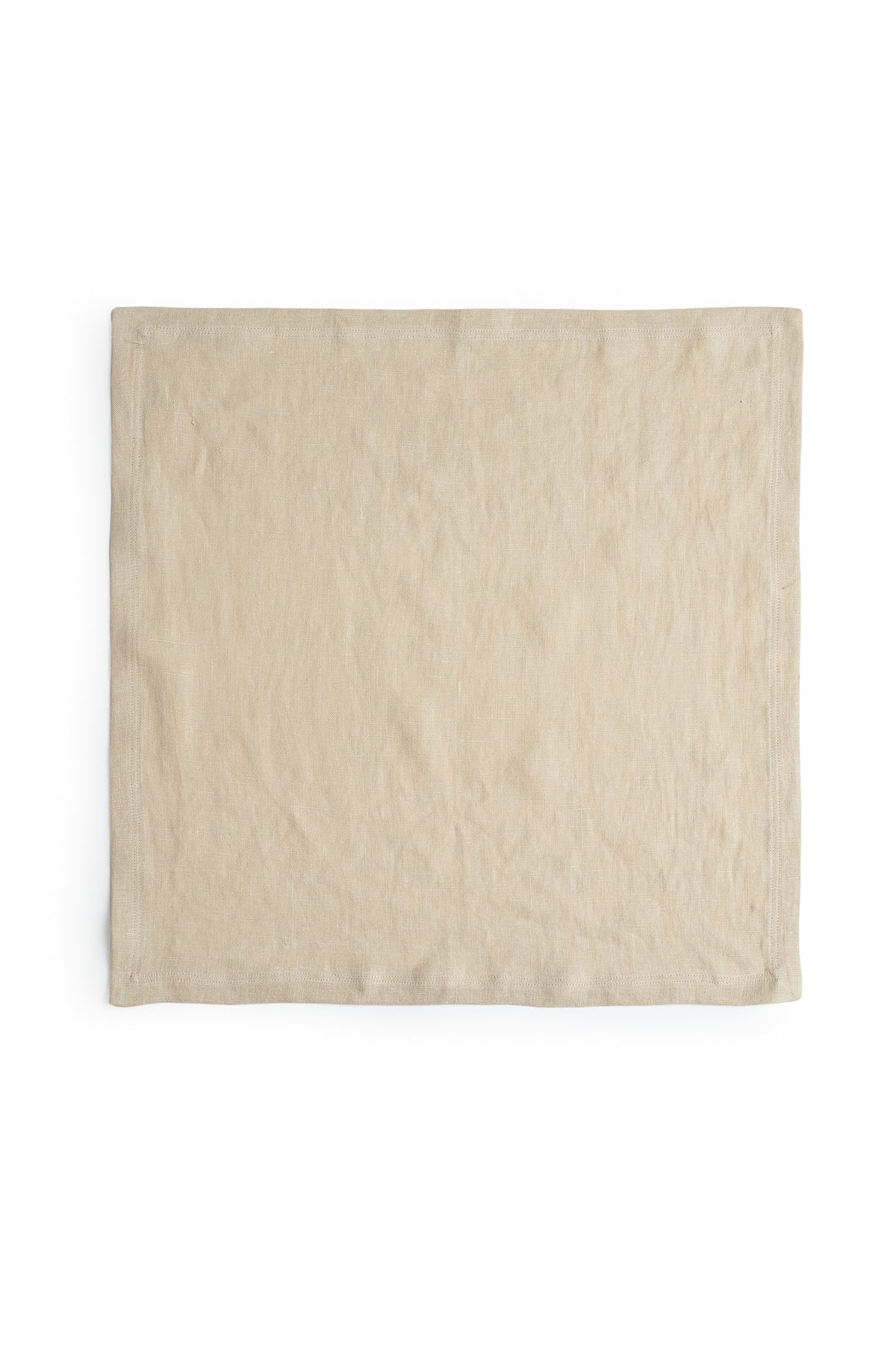   A beige linen napkin with a luxe finish on a white background from Jenny Graham Home. 