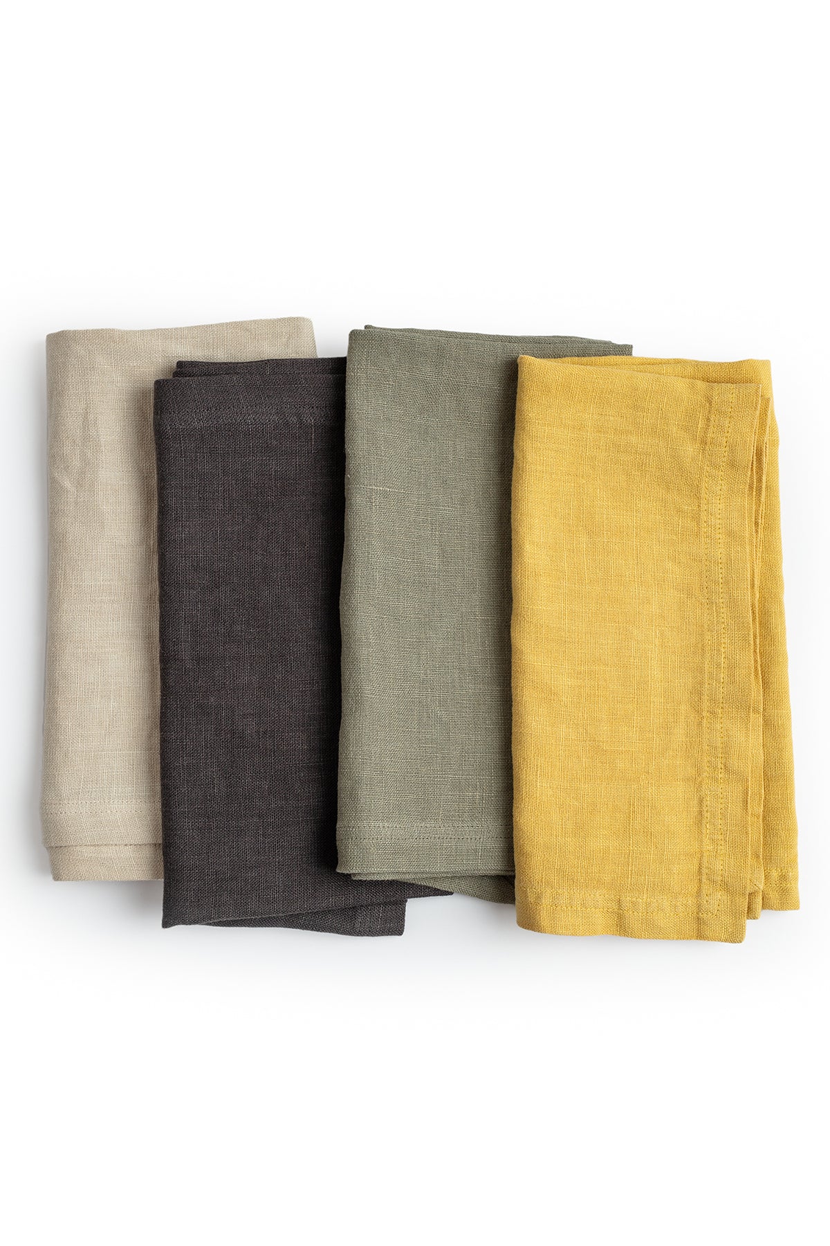Four elegant Jenny Graham Home linen napkins in beige, charcoal, olive green, and mustard yellow, neatly folded and stacked on a white background.-15073421230273