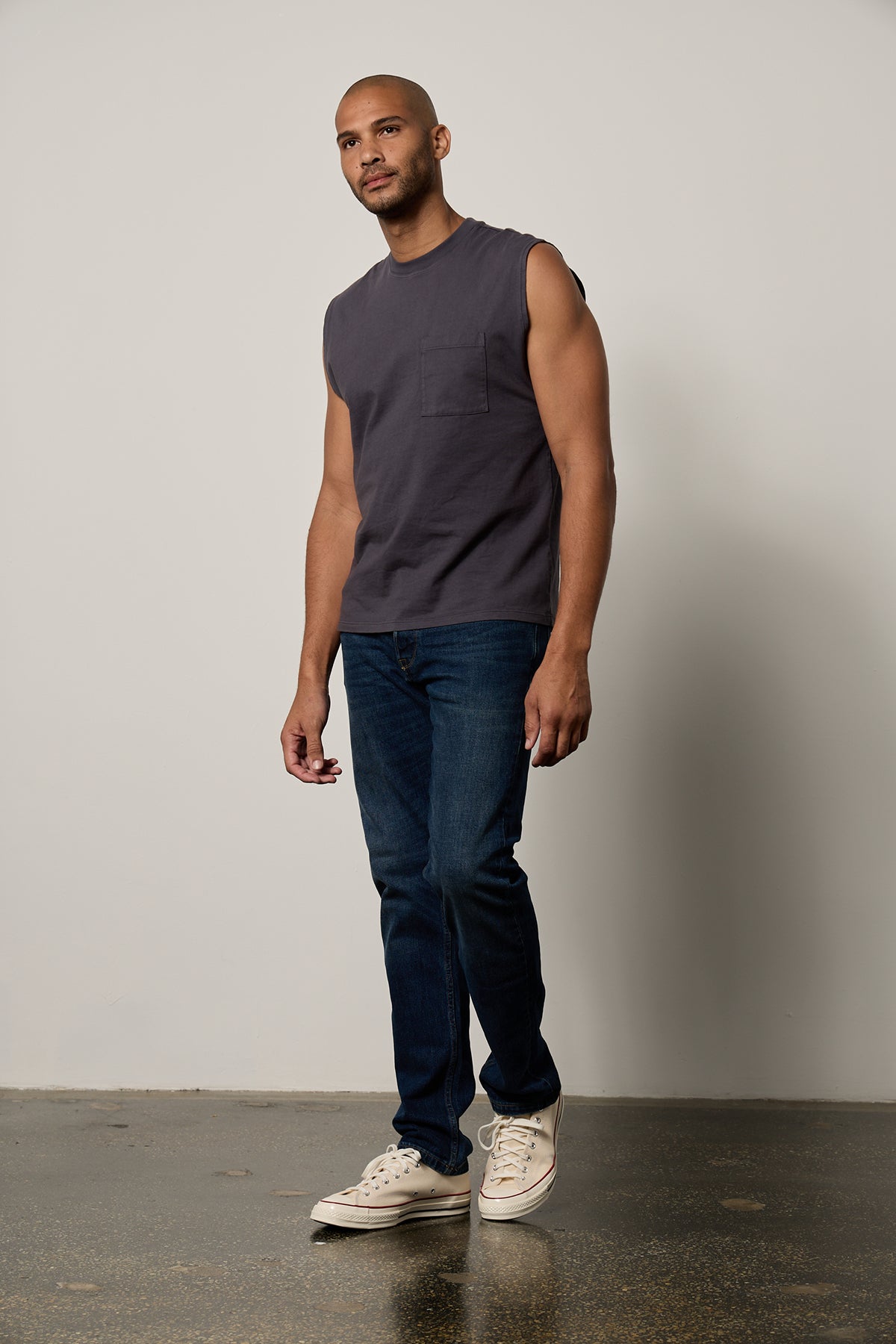 a man wearing jeans and a Velvet by Graham & Spencer LAYNE CREW NECK MUSCLE TEE-26266402095297