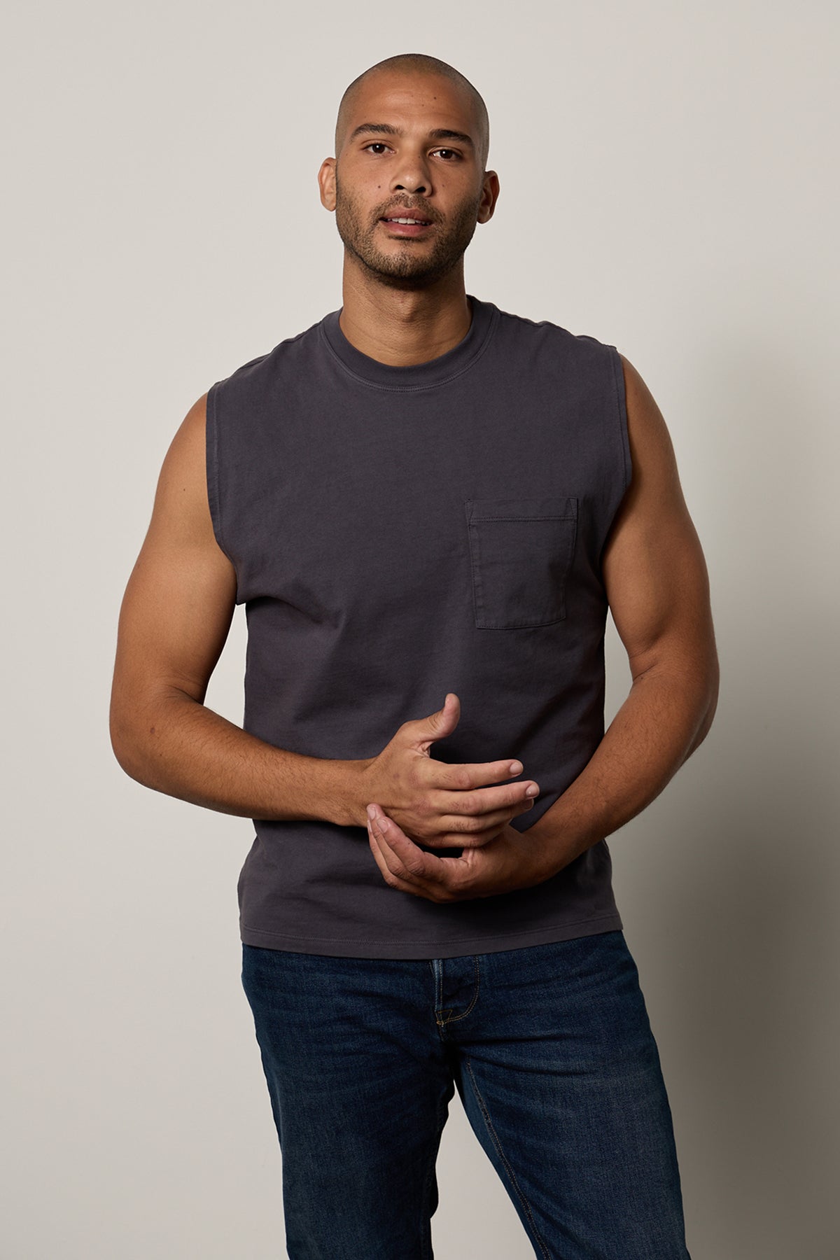   a man wearing a gray Velvet by Graham & Spencer Layne Crew Neck Muscle Tee. 