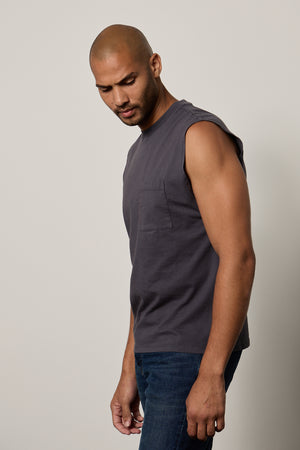a man wearing jeans and a Velvet by Graham & Spencer LAYNE CREW NECK MUSCLE TEE.