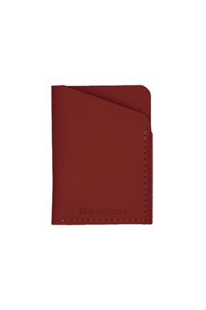 A SOFT LEATHER CARD HOLDER BY LIMA SAGRADA, crafted by local artisans, on a white background.