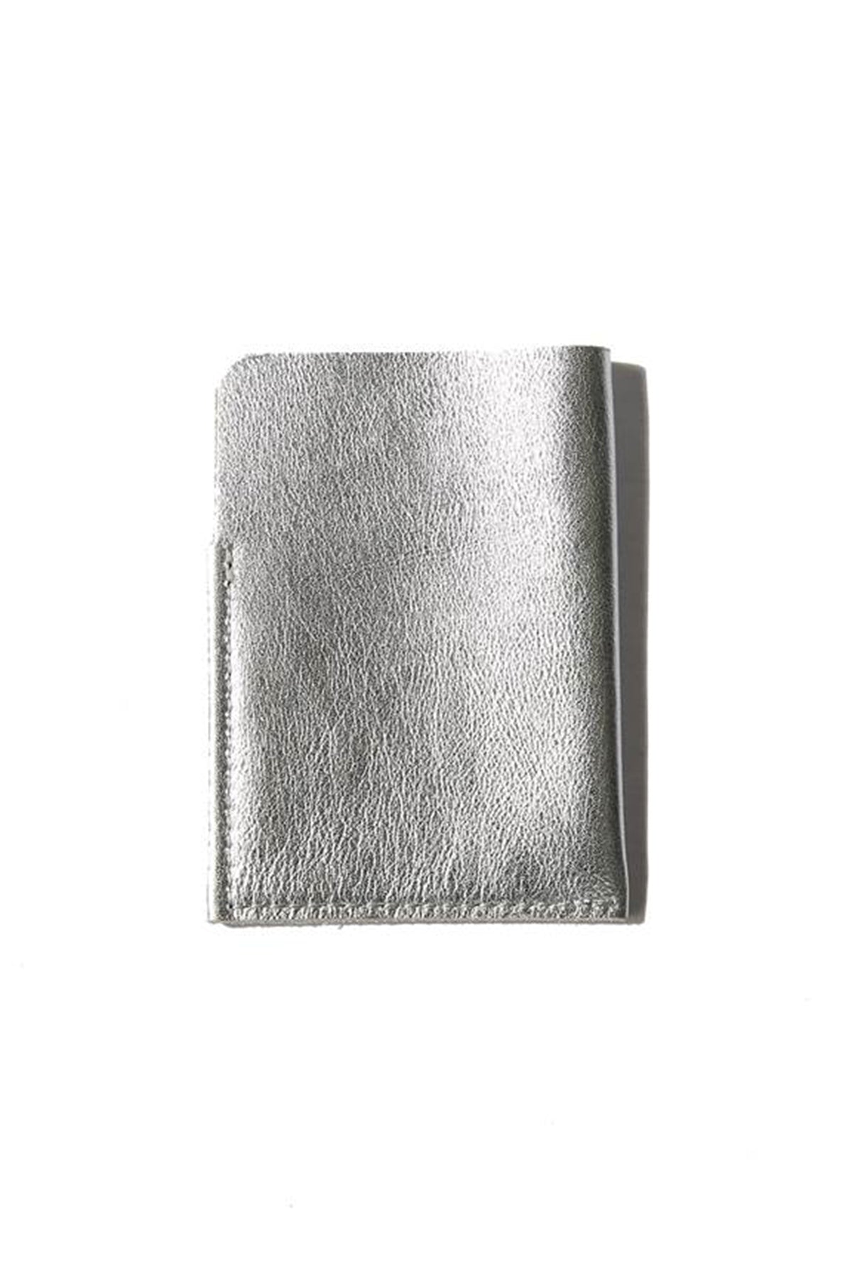 A minimalistic SOFT LEATHER CARD HOLDER BY LIMA SAGRADA, by a local artisan, placed on a white surface.-600106664017