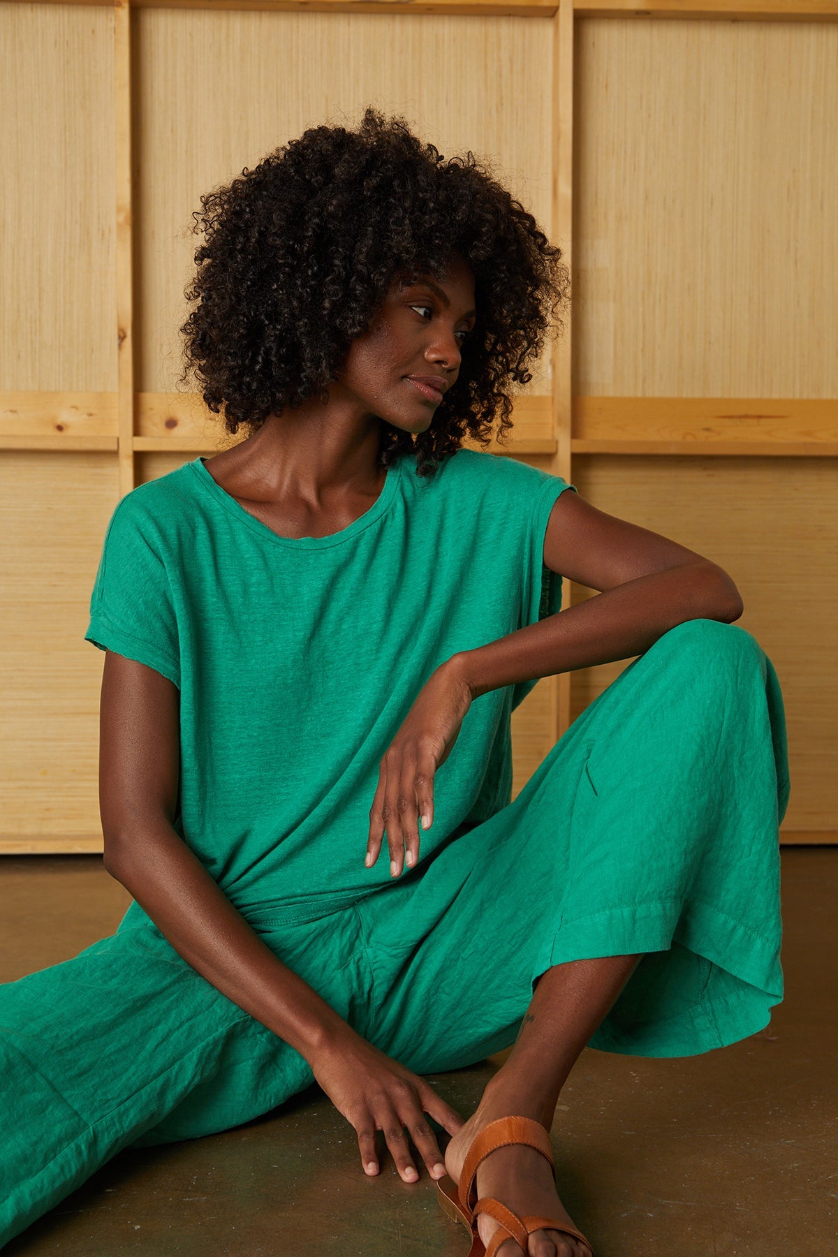 Model sitting wearing Lola linen pant and Hudson Tee in apple-25329014472897