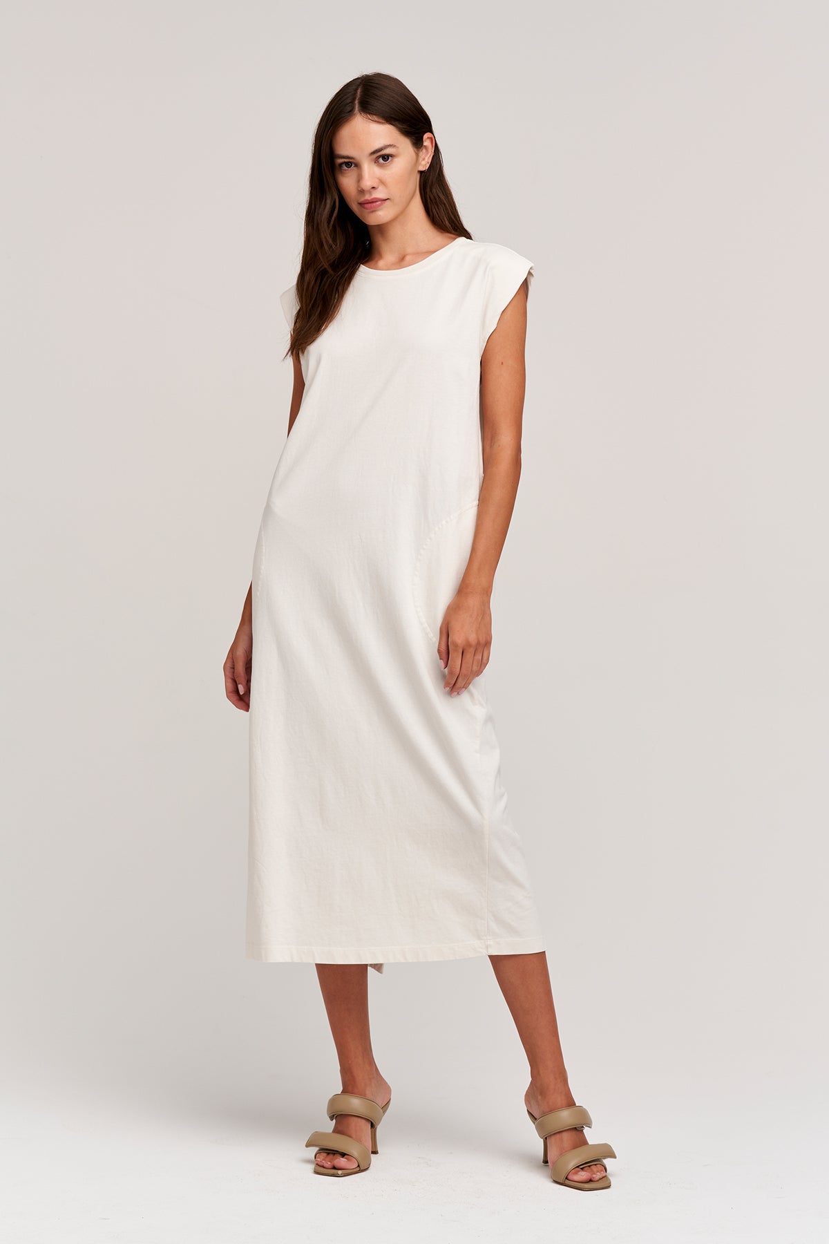 A model wearing the KENNY SLEEVELESS DRESS by Velvet by Graham & Spencer.-24313229312193