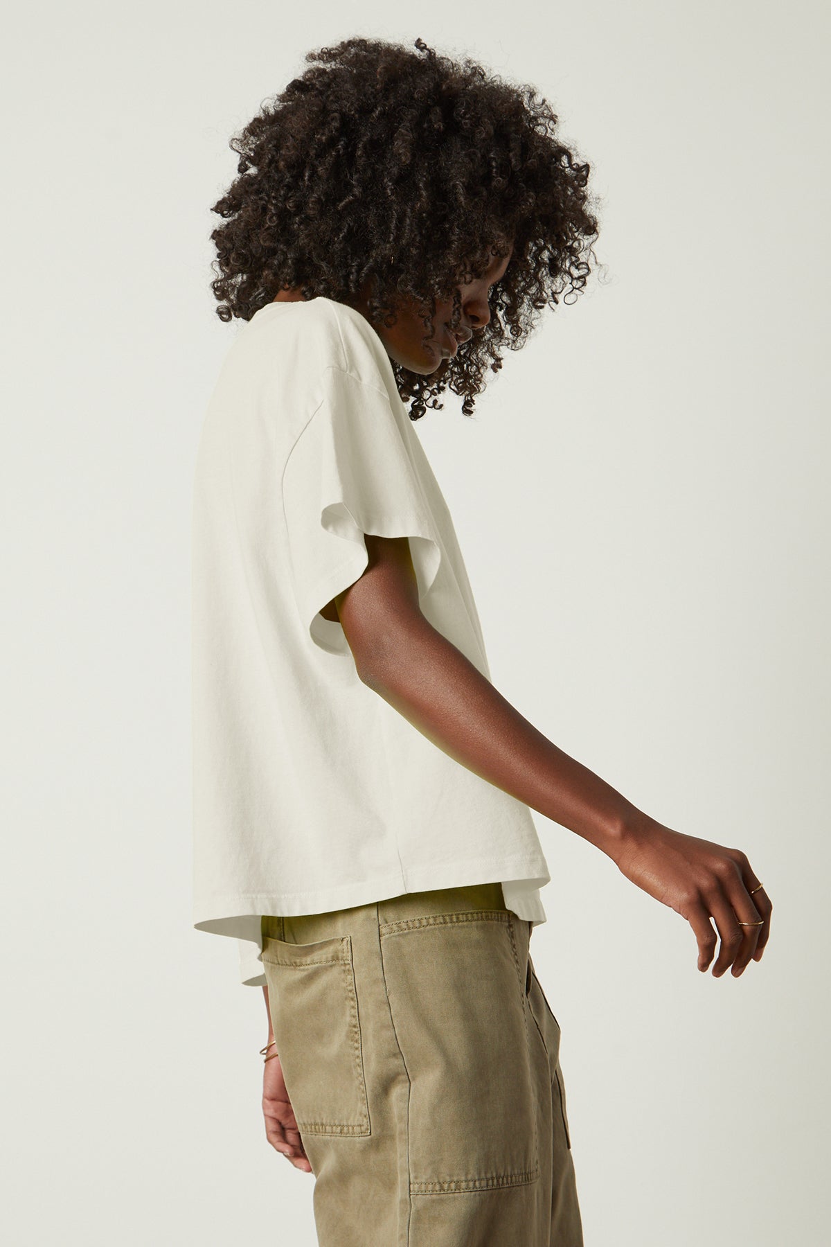 a woman wearing khaki pants and a Velvet by Graham & Spencer RACHELLE OVERSIZED CREW NECK TEE.-26182403883201
