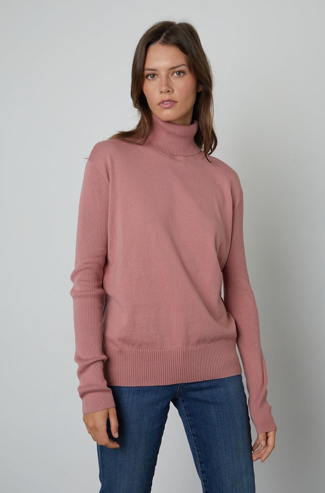 A model wearing a Velvet by Graham & Spencer RENNY turtleneck sweater for fall.-25583814967489
