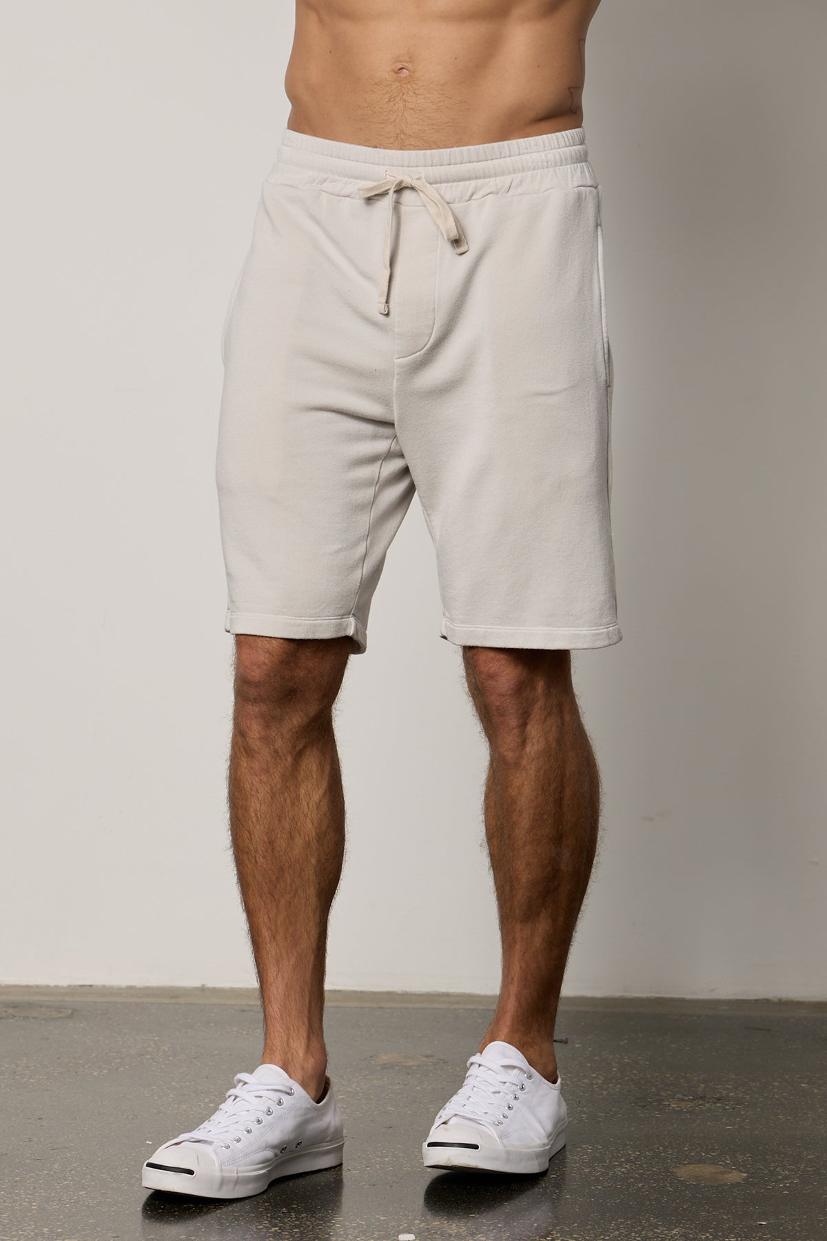   A man always on heavy rotation wearing a white tee shirt and Velvet by Graham & Spencer's ATLAS LUXE FLEECE DRAWSTRING SHORT. 