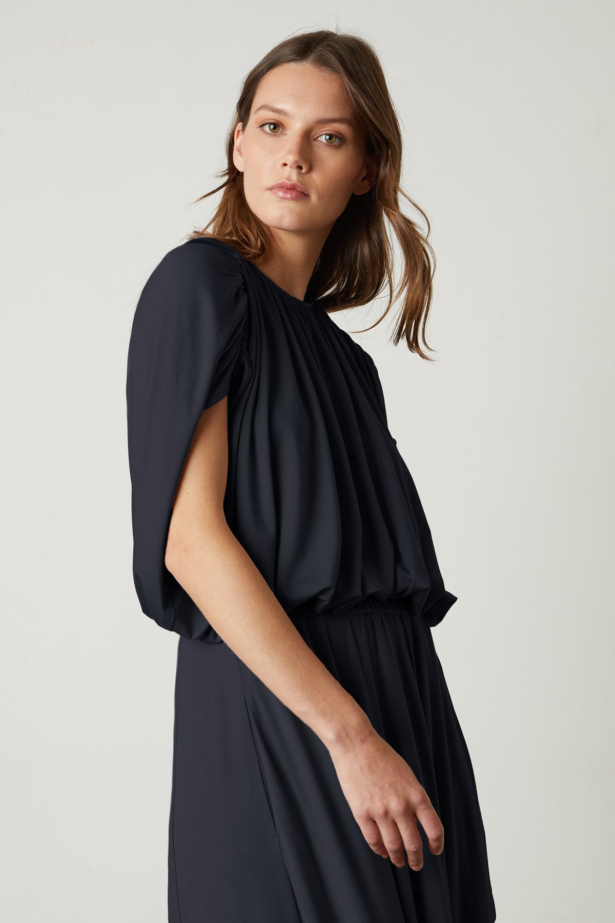 Carmen Cocoon Drape Top in black with Malaya skirt in black side.-25444318707905