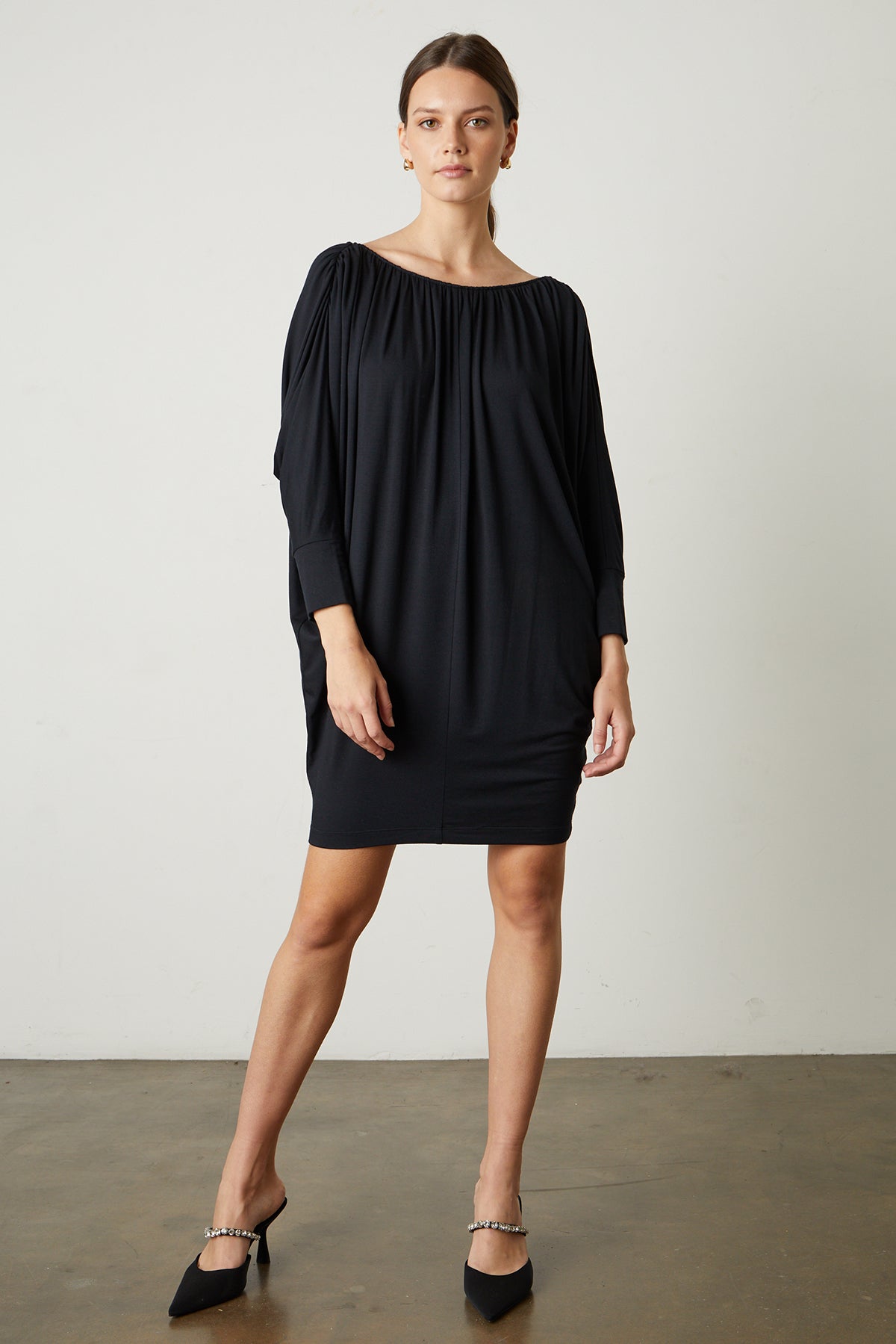 a model wearing a Velvet by Graham & Spencer HOLLIE DRAPE BOAT NECK DRESS.-25548634685633