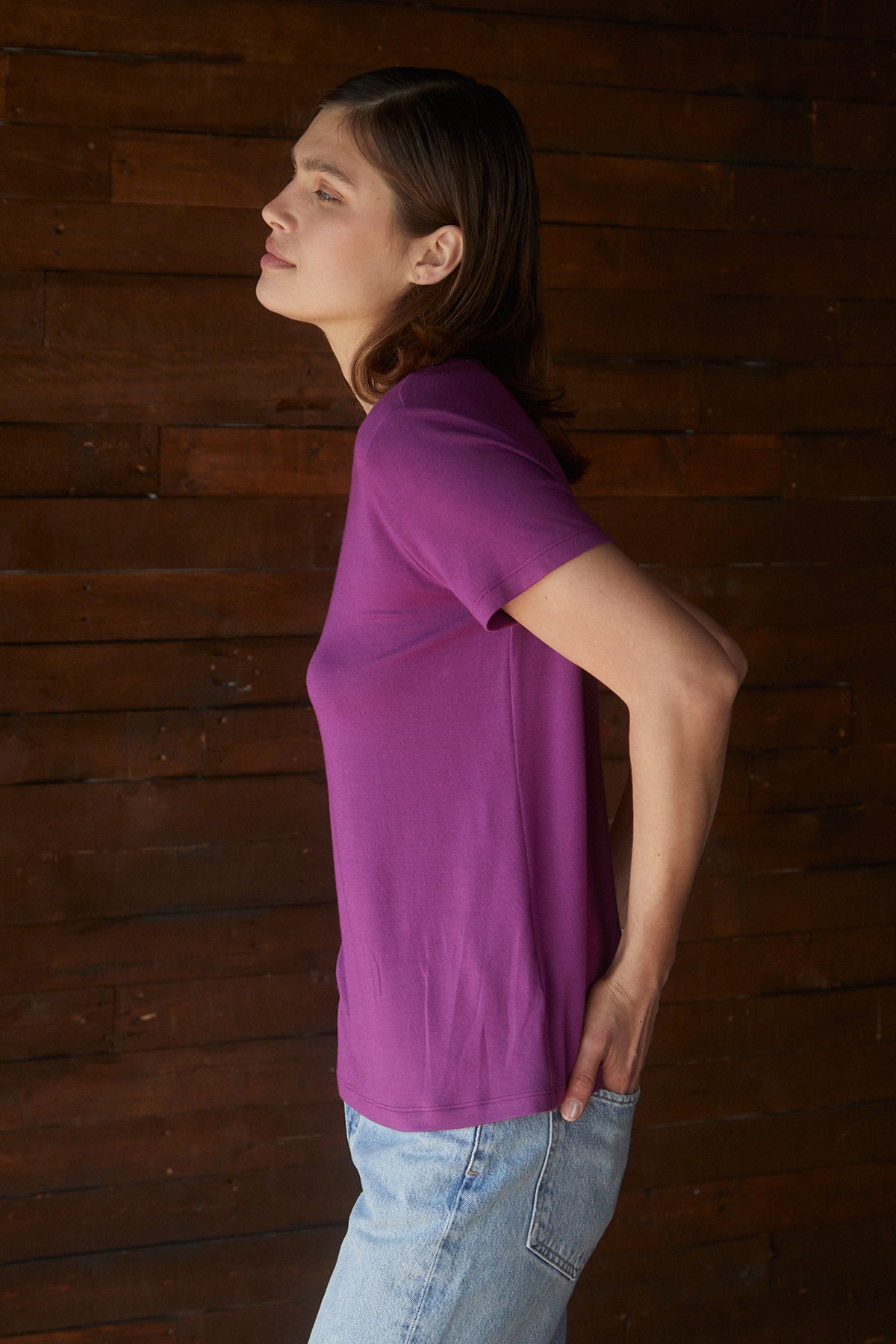 A woman wearing a Velvet by Jenny Graham SOLANA Tee purple t-shirt and jeans.-25483479253185