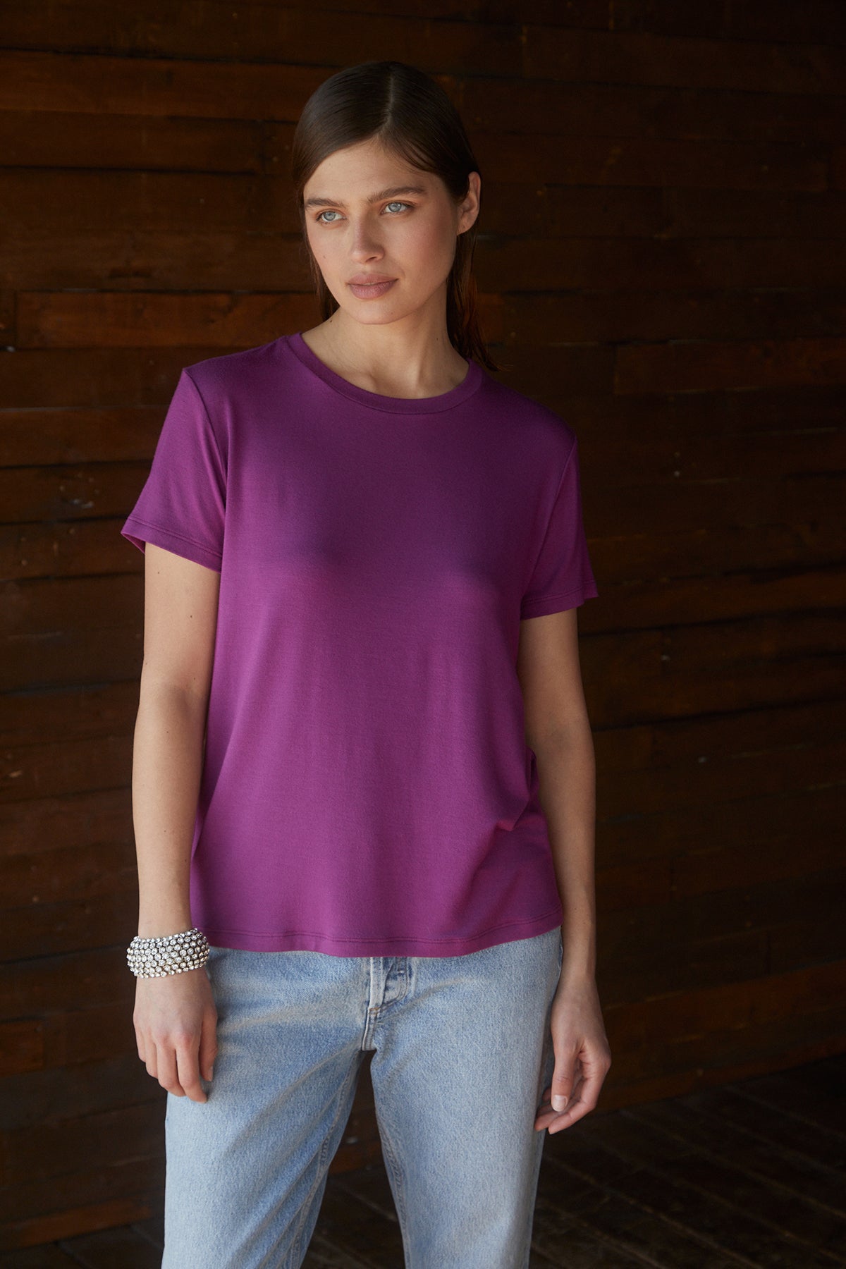 A woman wearing a Velvet by Jenny Graham SOLANA TEE jeans.-25483479318721