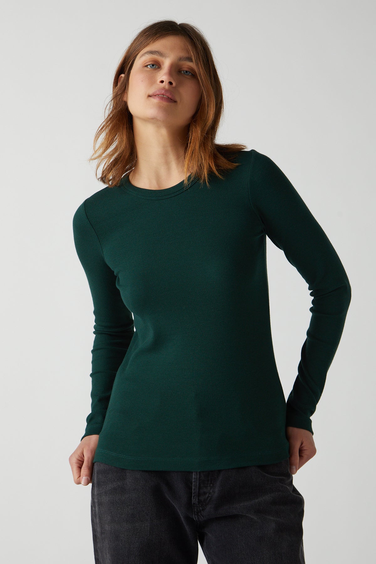 Camino Tee in forest green with black denim front-25483428659393