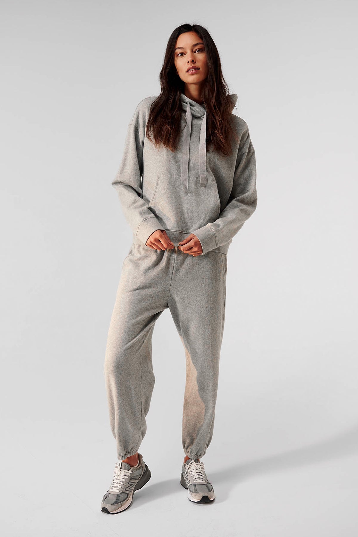   a woman wearing a grey hoodie and Velvet by Jenny Graham ZUMA SWEATPANT. 